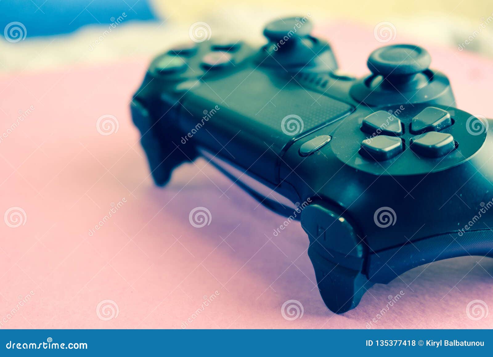 a beautiful black modern digital game joystick to control a video game console for video games with buttons and keystrokes and