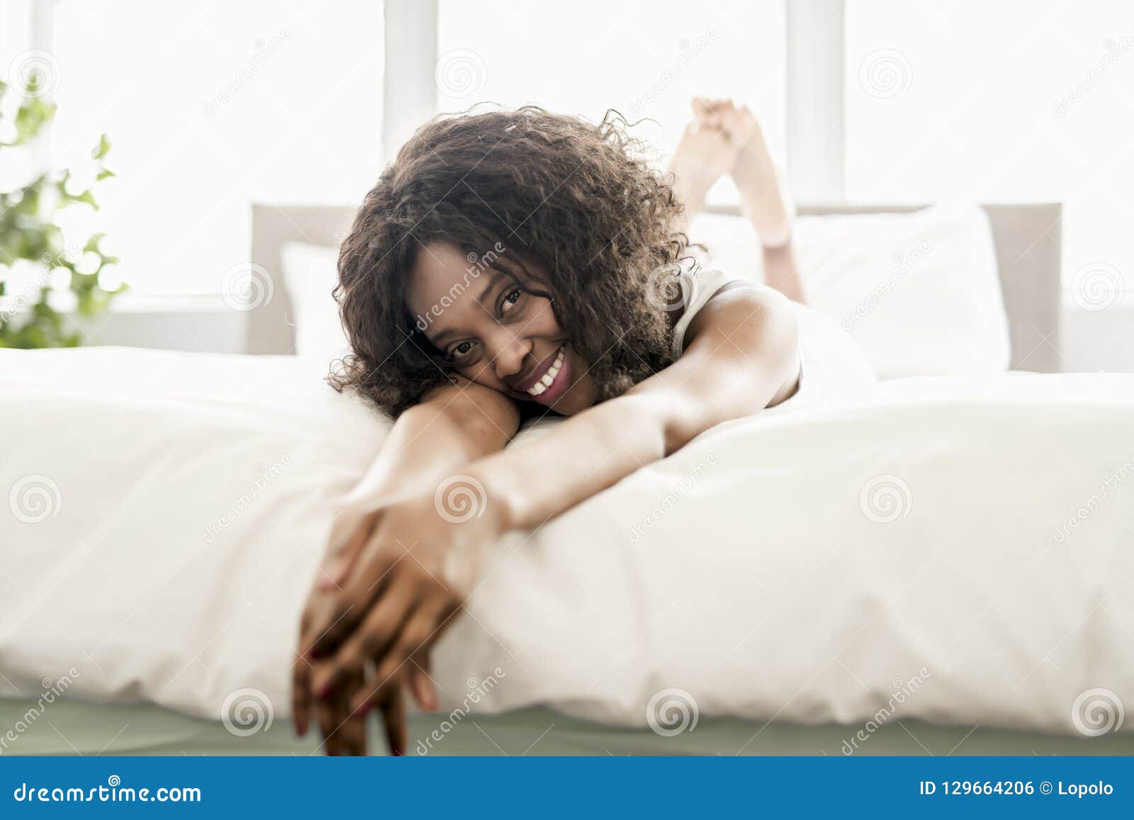 Beautiful Black Woman On A White Bed Stock Photo - Image of female, blanket: 129664206