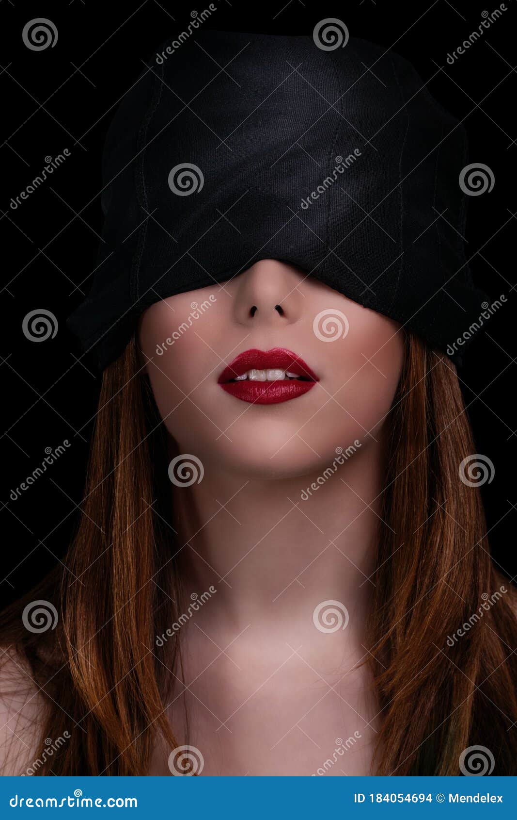 Young Woman Wearing Black Blindfold Isolated On Grey Stock Photo