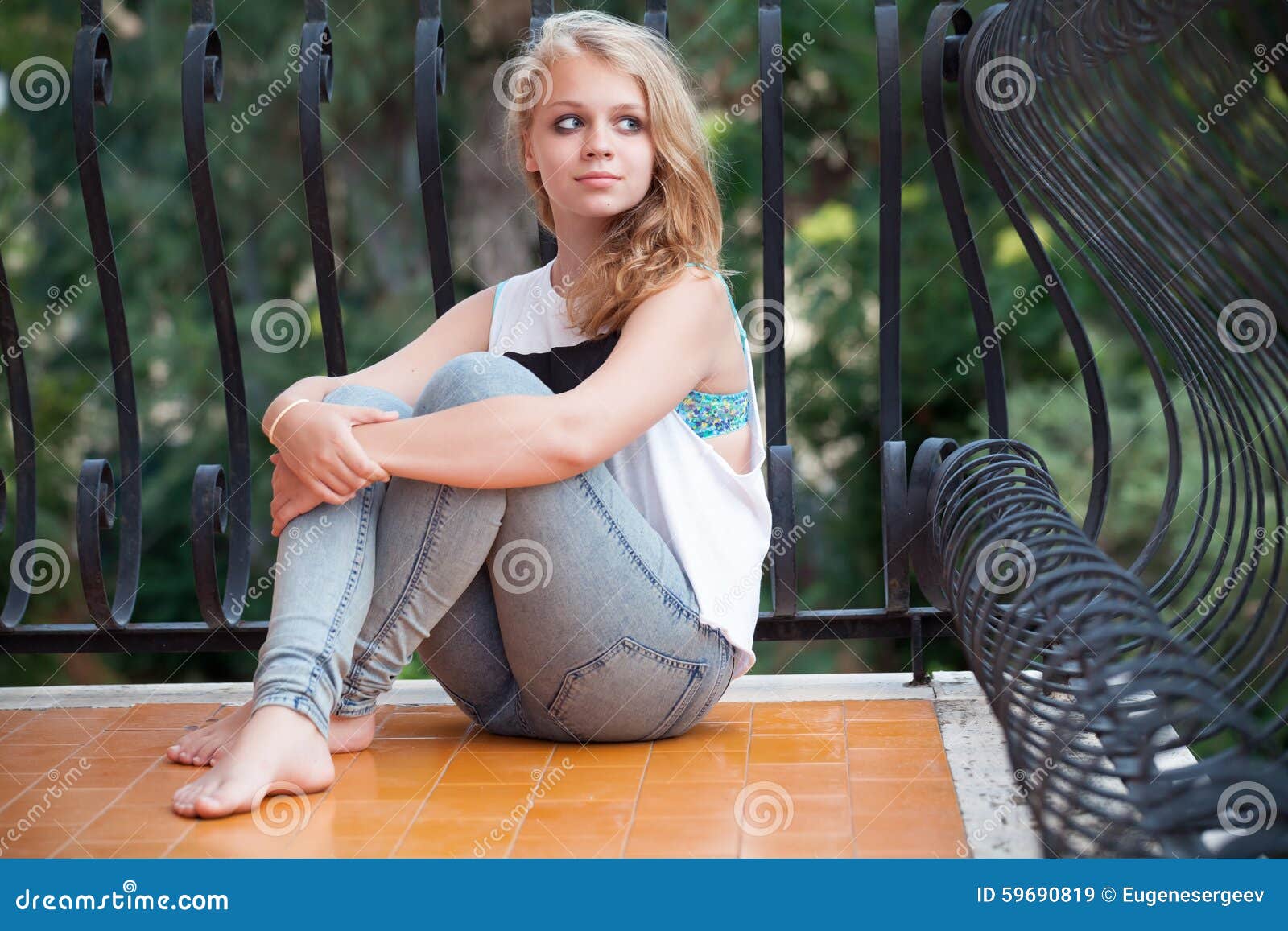 Beautiful Blond Caucasian Teenage Girl On Balcony Stock