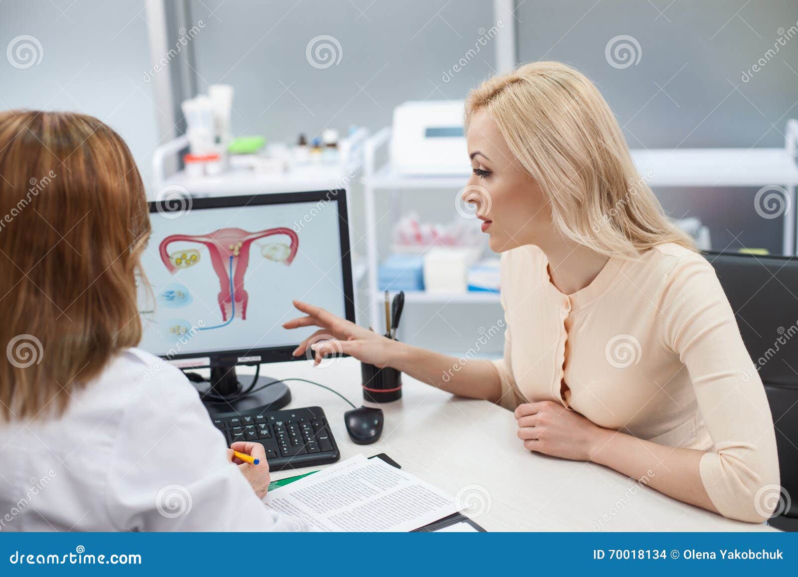 beautiful blond girl is consulting with gynecologist