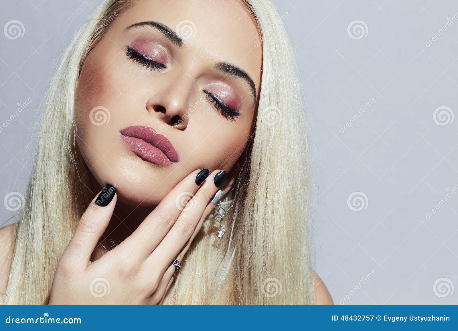 beautiful blond woman with professional make-up. beauty girl. shellac manicure