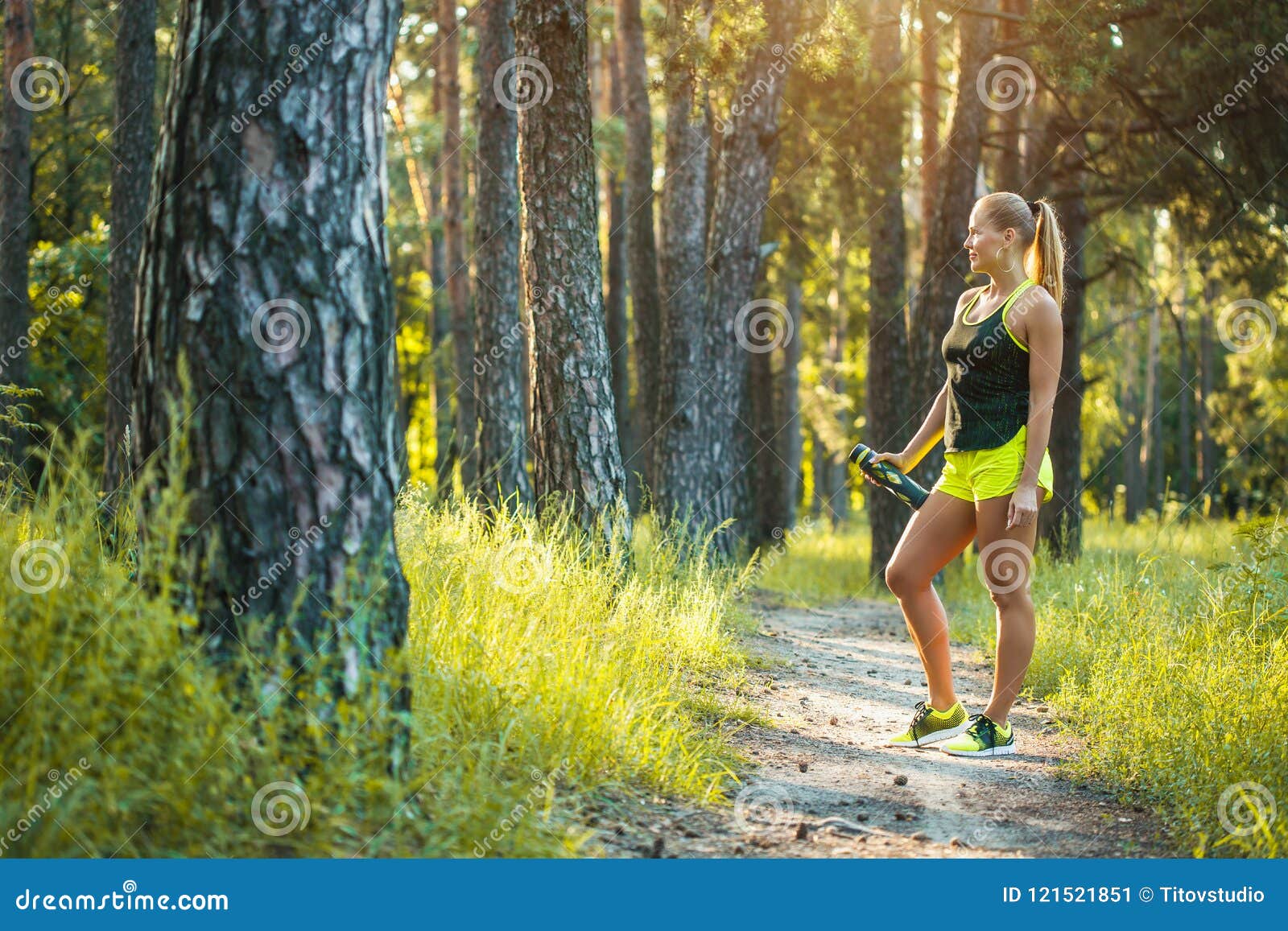 Beautiful Blonde Athletic Woman On A Run In The Forest Stock Image