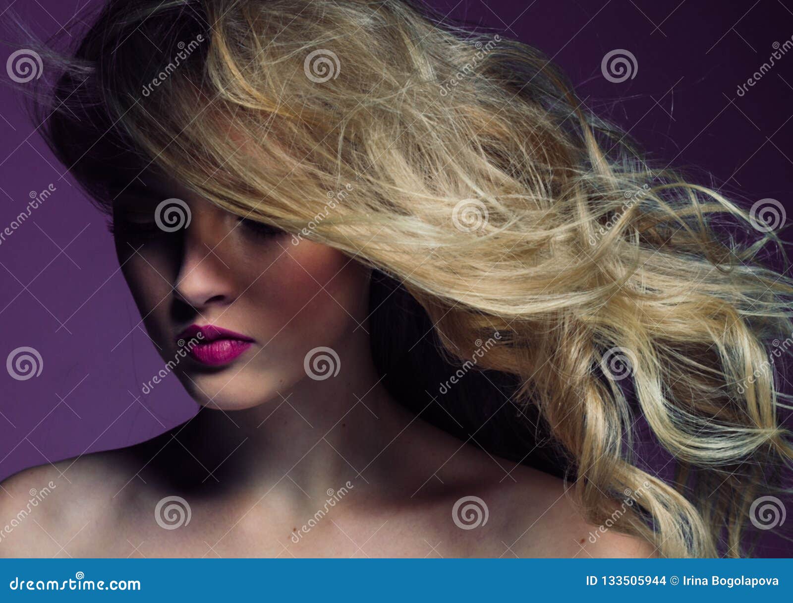 Beautiful Blonde Girl with Long Curly Hair Over Purple Background Stock ...