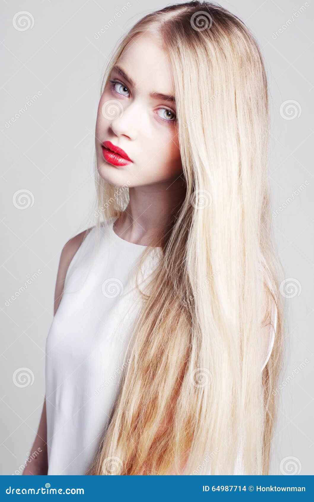 Beautiful Blonde Girl With Long Hair And Green Eyes Stock Photo