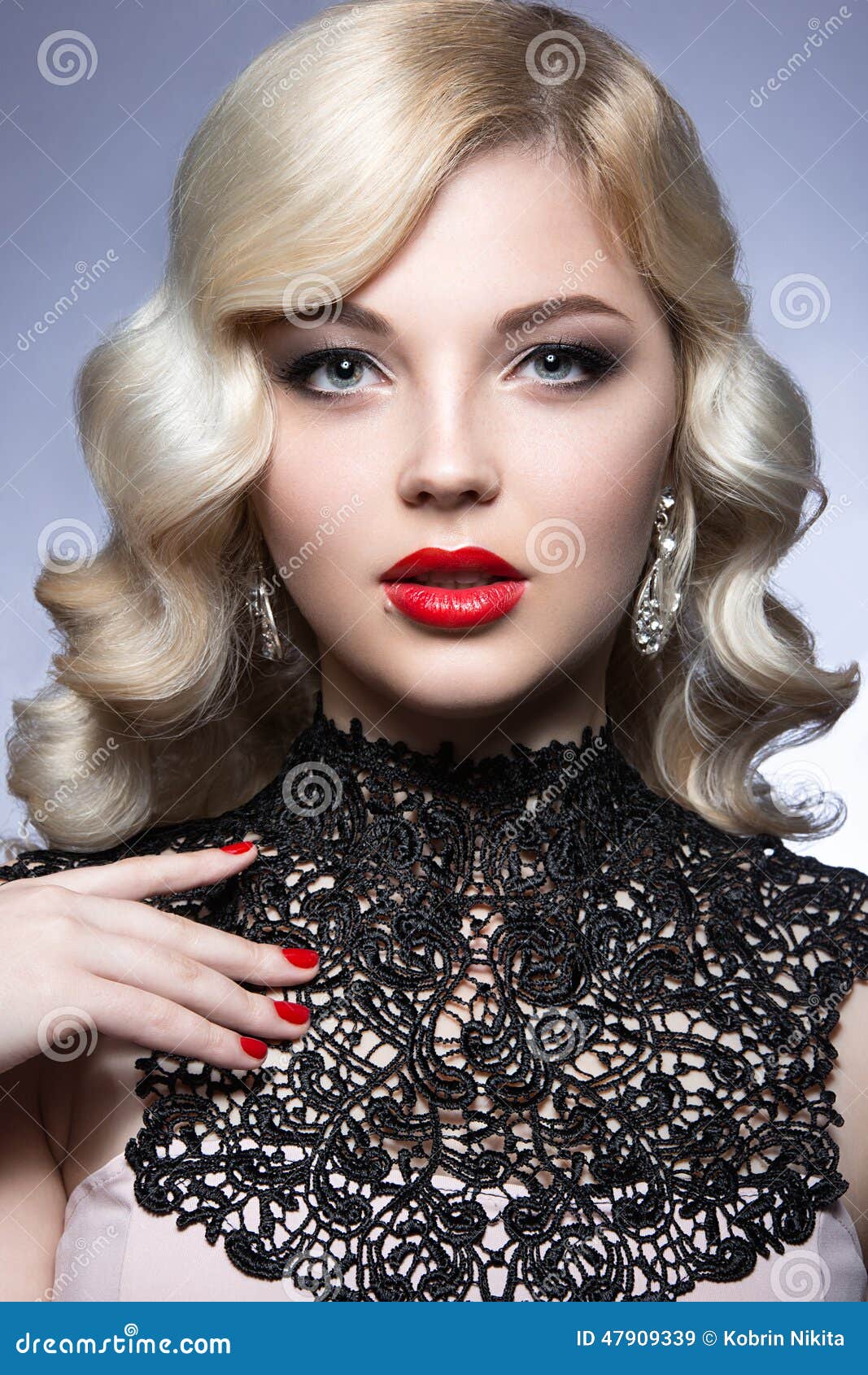 Beautiful Blonde In A Hollywood Manner With Curls, Red Lips And Lace