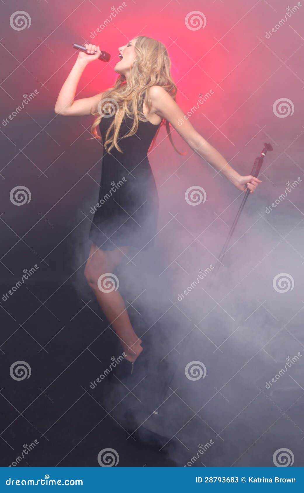 Beautiful Blonde Rock Star On Stage Singing Stock Image