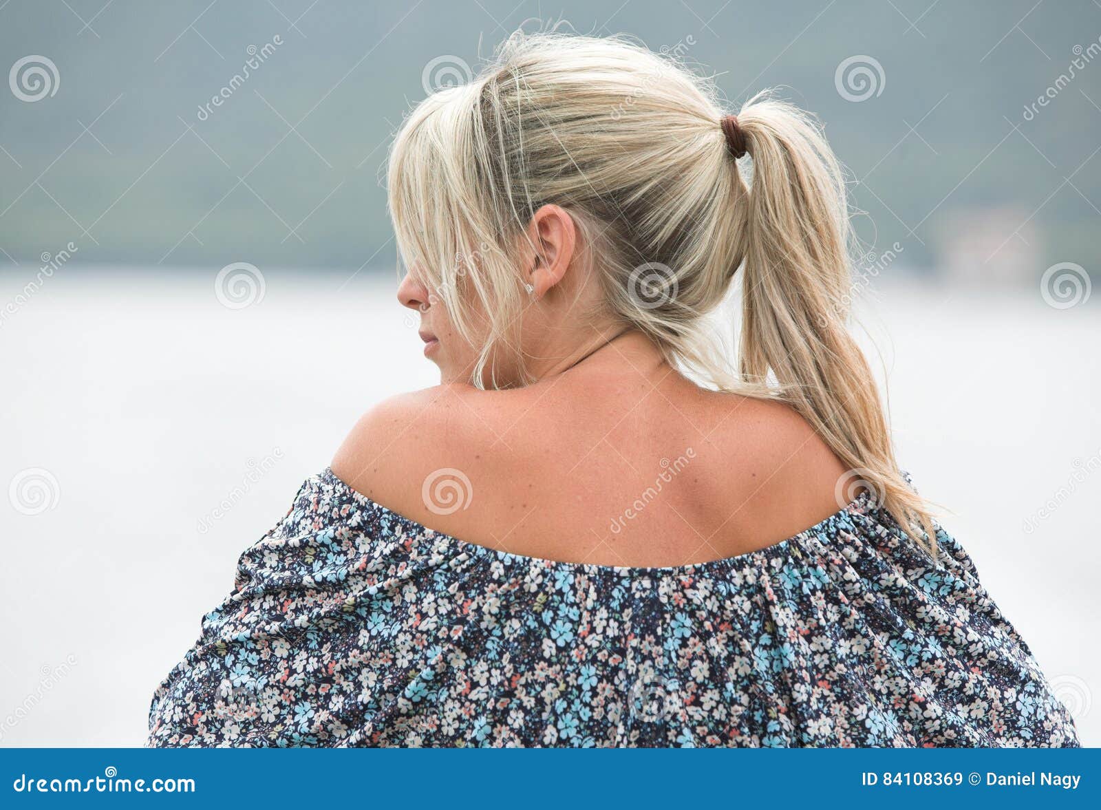 Beautiful Blonde Woman Back And Face From Behind Outdoors Stock