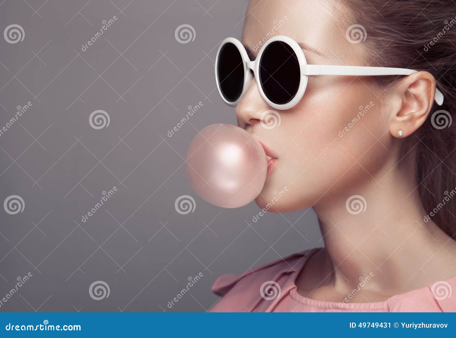 beautiful blonde woman blowing bubble gum. fashion portrait.