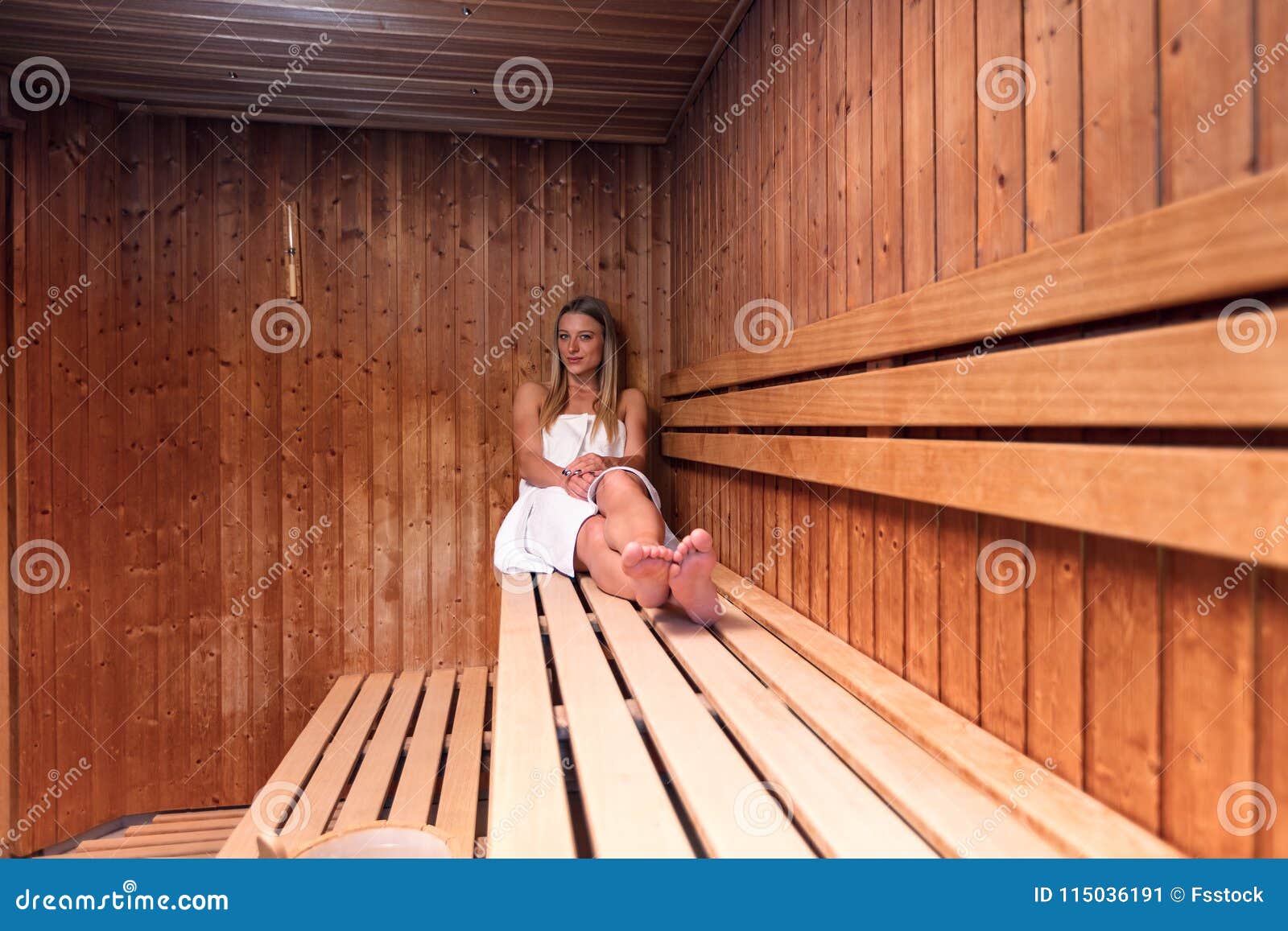 African American Woman Relaxing In Sauna With Her Eyes 