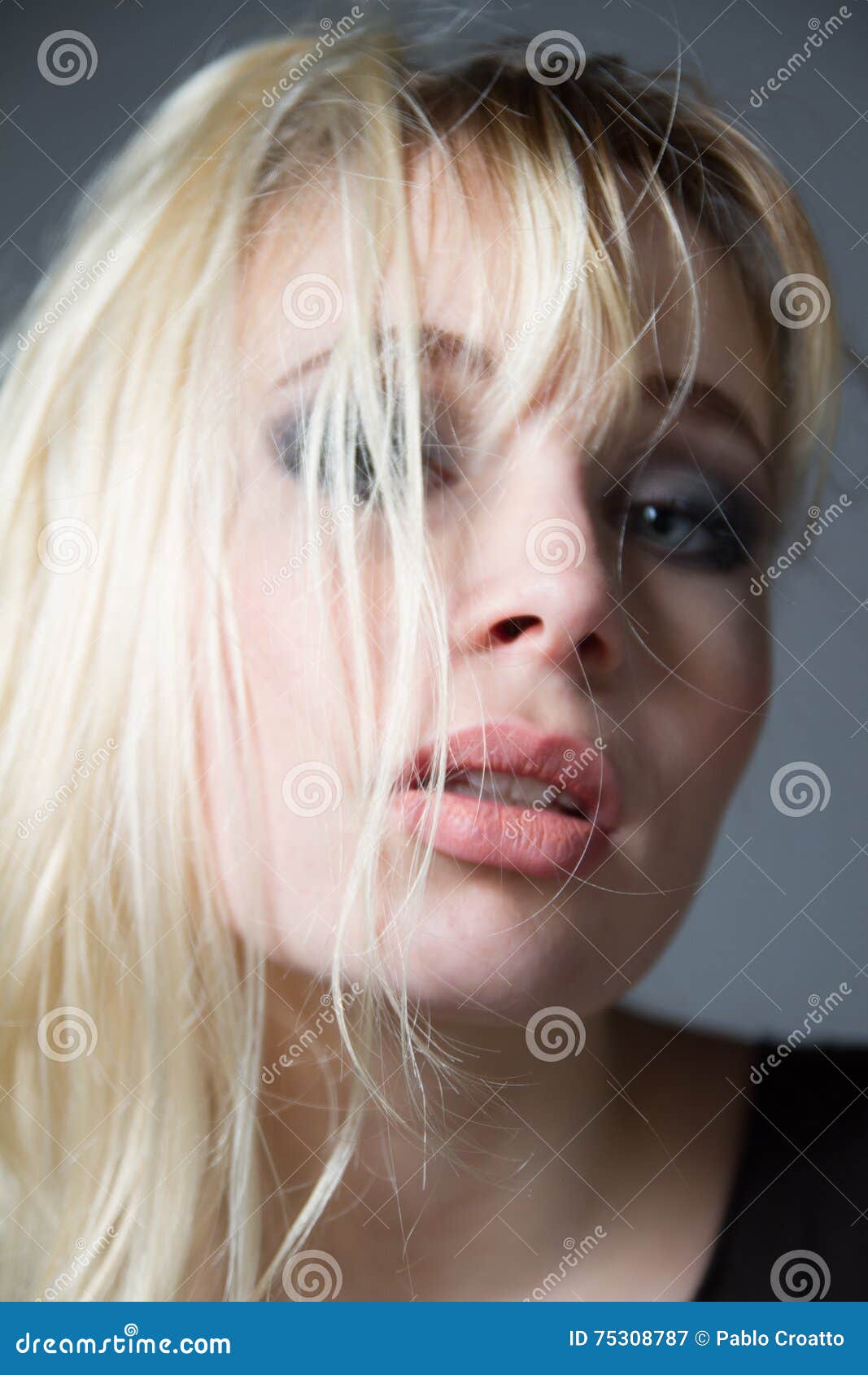 Beautiful Blue Eyes Blonde Looking At Camera Indoors Stock Image