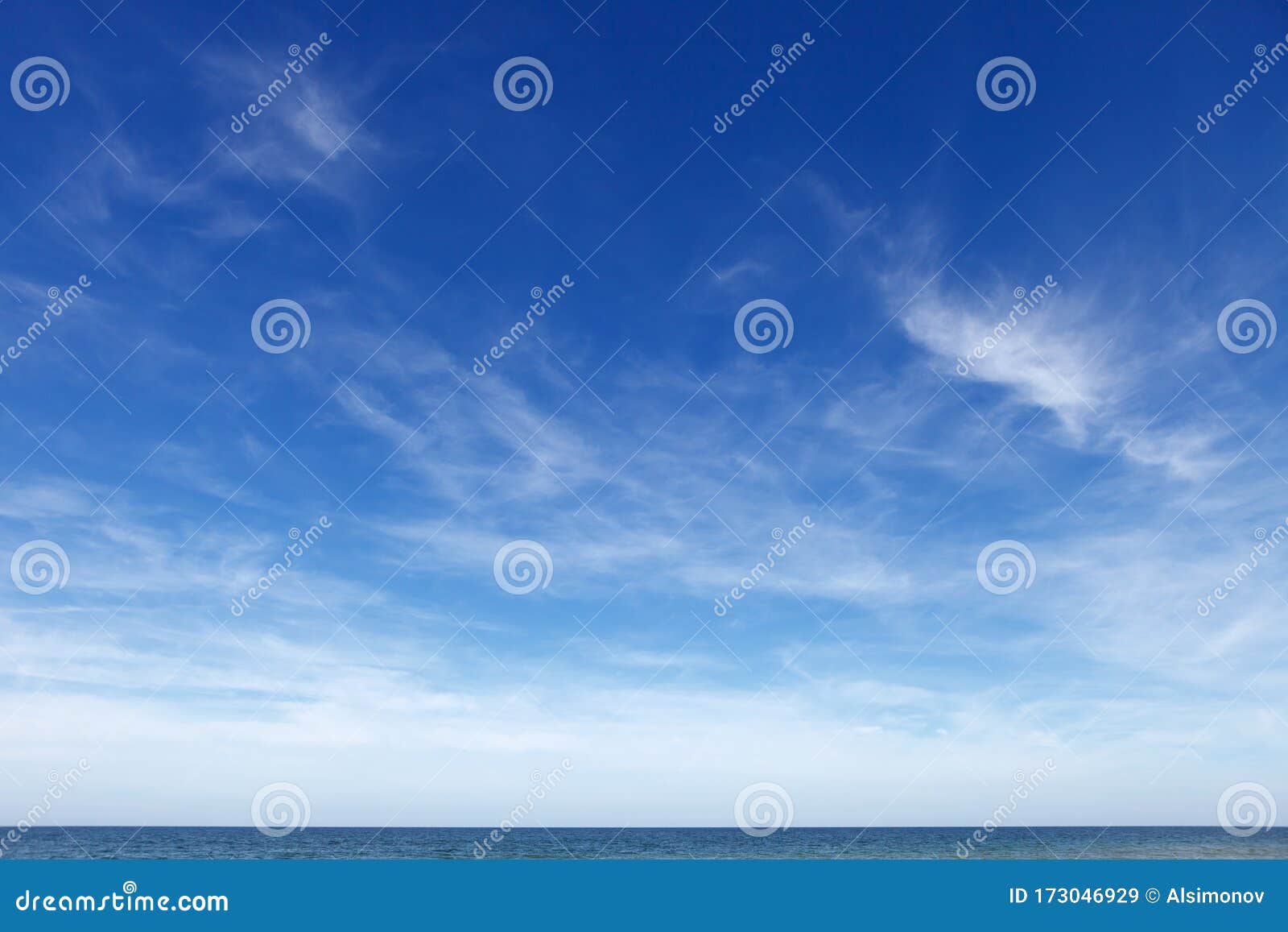 beautiful blue sky with cirrus clouds over the sea. skyline