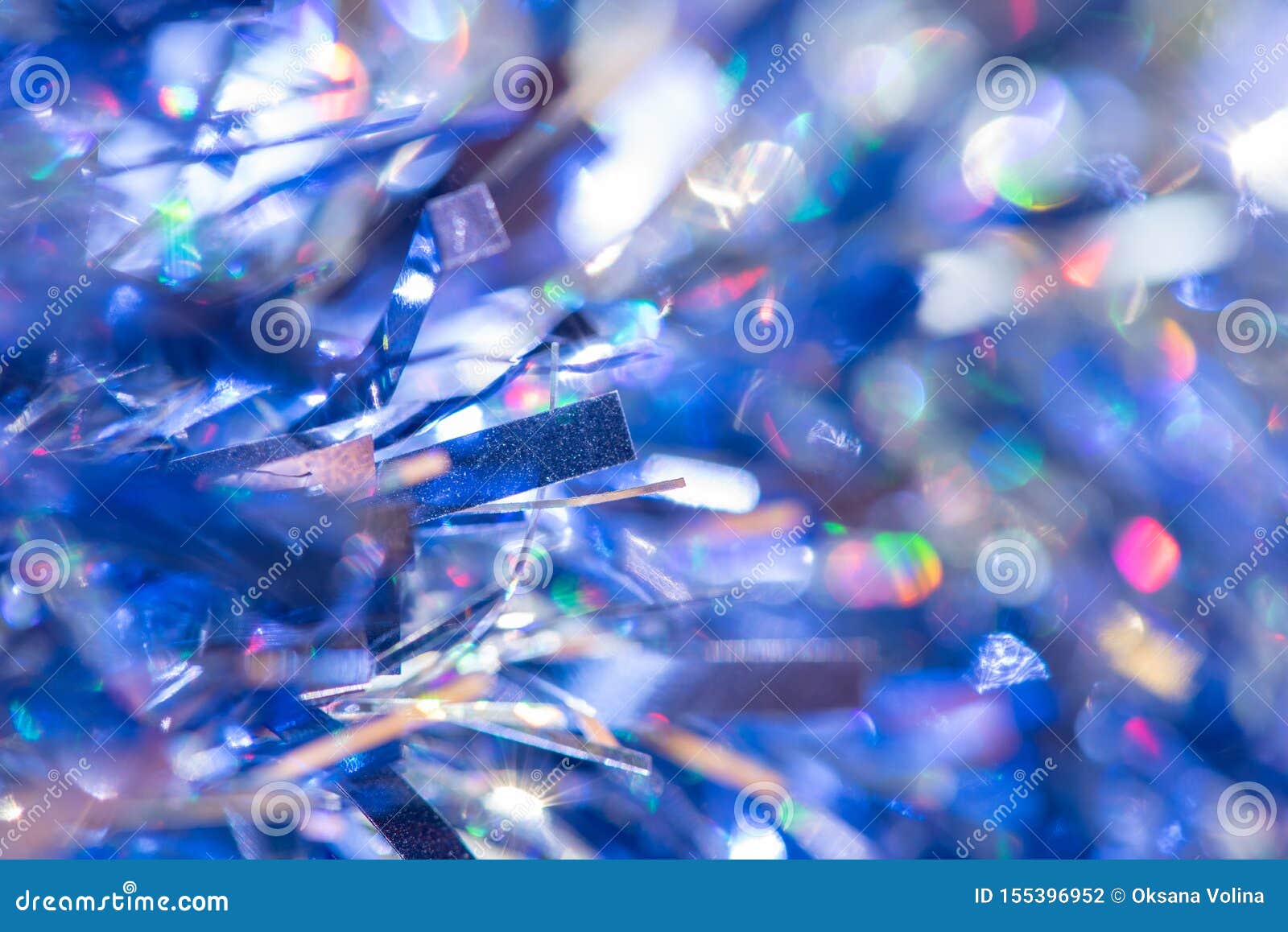 Beautiful Blue Tinsel on Glitter Background for Festive Design Stock