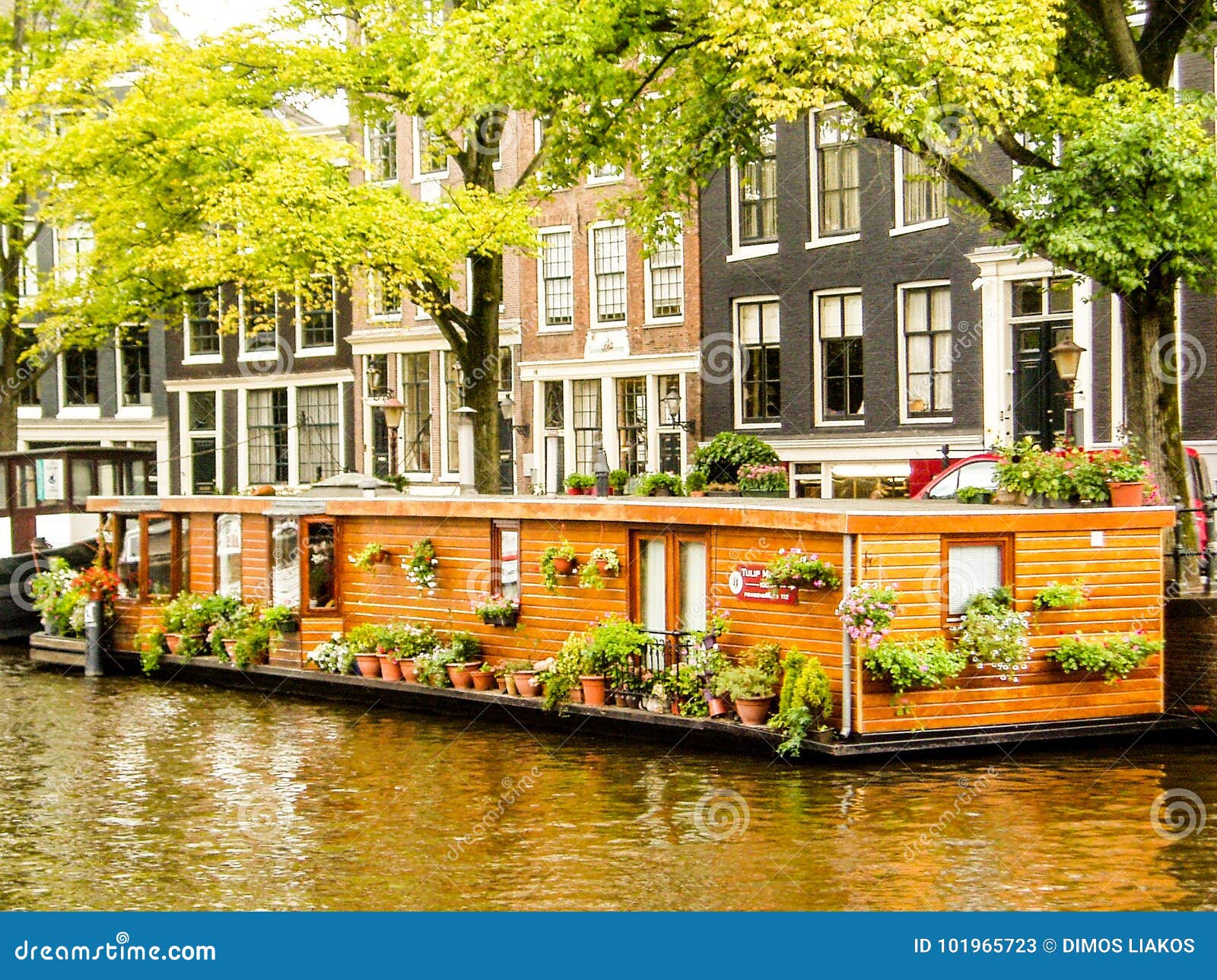 Beautiful Boat House in a Canal of Amsterdam Editorial Stock Photo