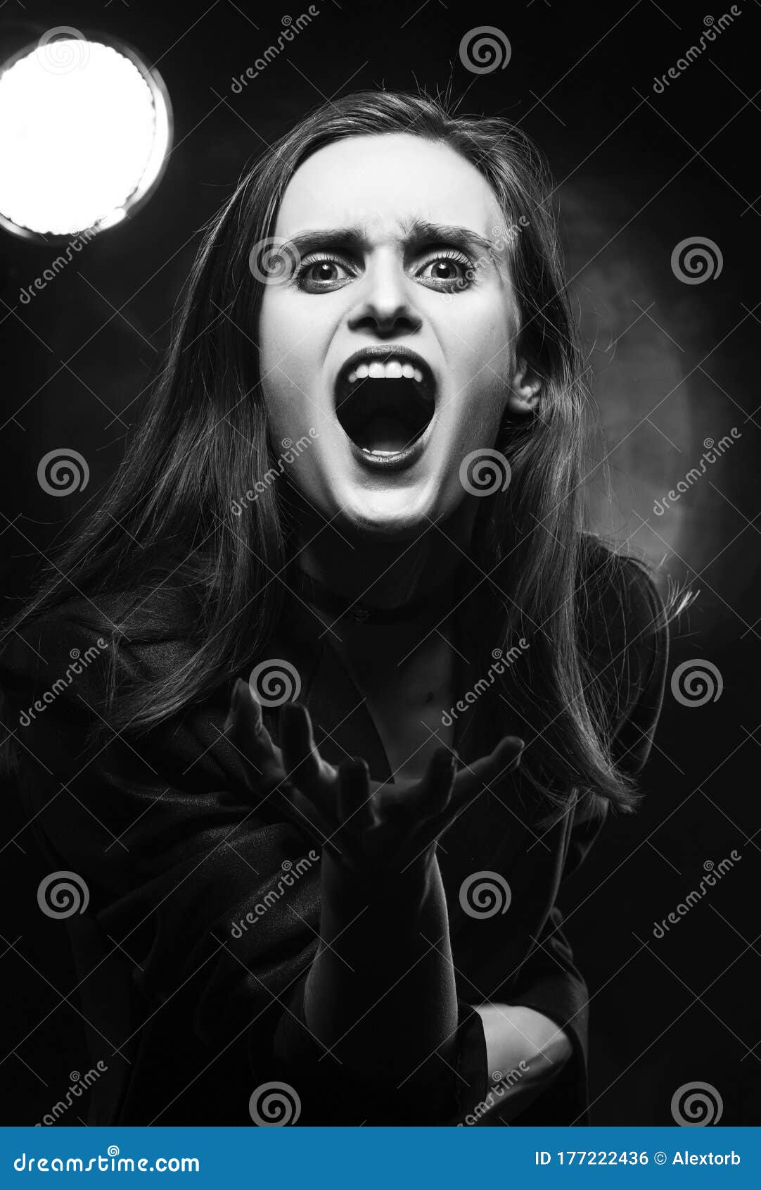 Beautiful Braless Girl with Red Lips, Wearing a Black Blazer, Screams ...