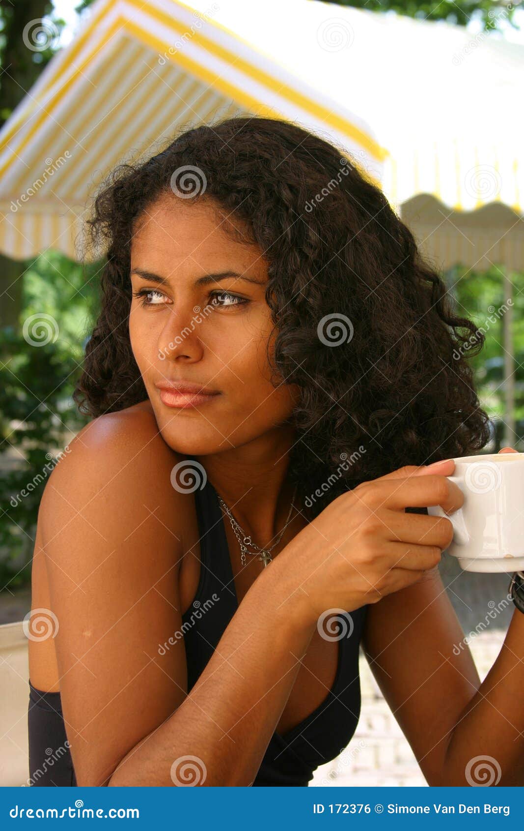 A Beautiful Brazilian Woman In A Red Dress Poses In The Studio Stock ...