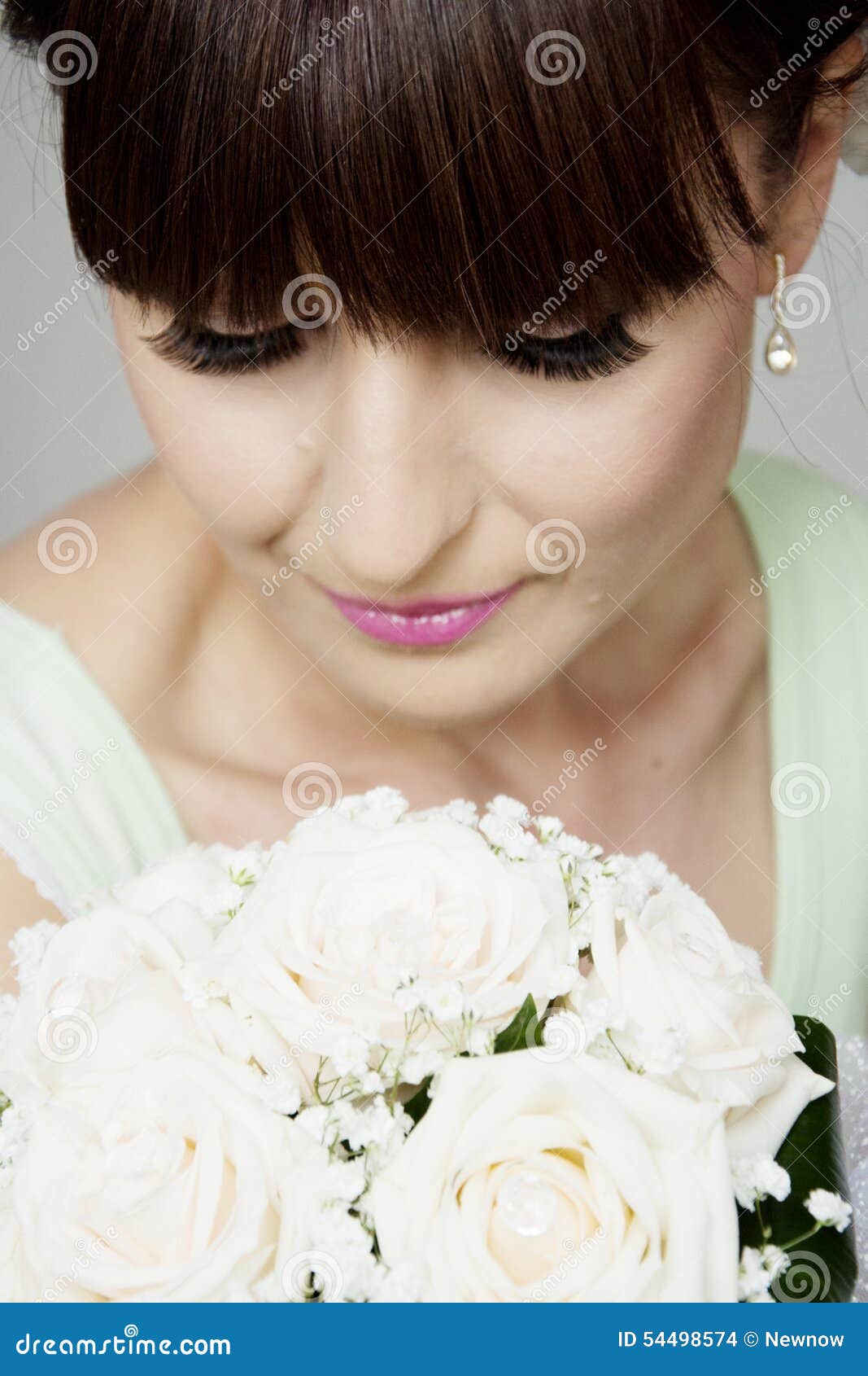 beautiful bride with her bouquet closeup