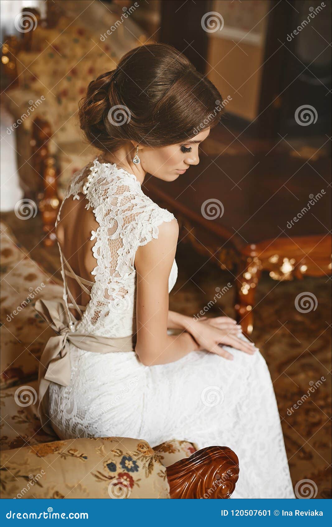 Beautiful Bride, Young Model Brunette Woman, in Stylish Wedding Dress with Naked  Back Sits on the Vintage Sofa and Posing in Luxur Stock Image - Image of  beauty, beautiful: 120507601