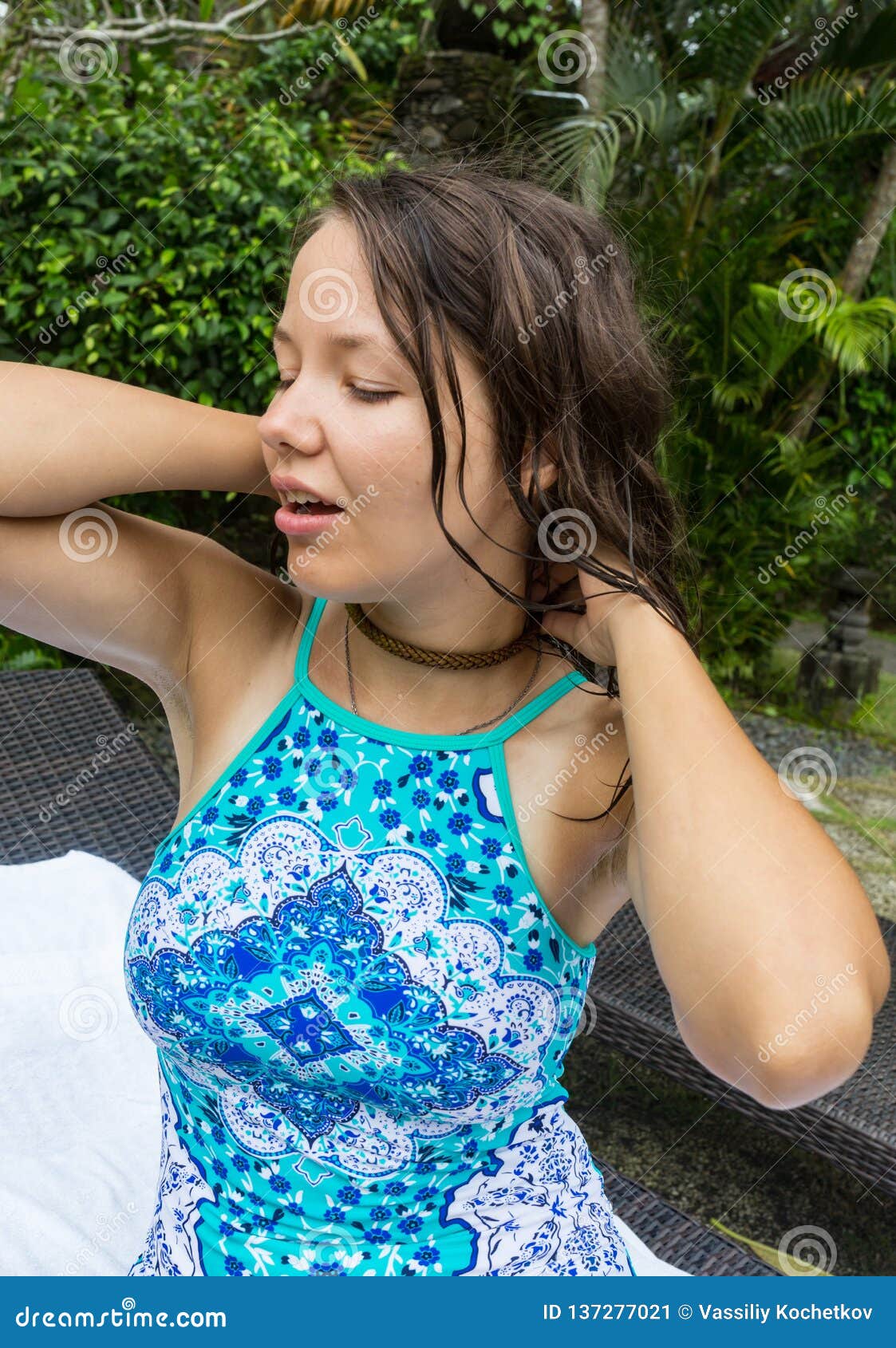 Beautiful Brunette Girl In Blue Swimsuit Posing In Tropical Location 