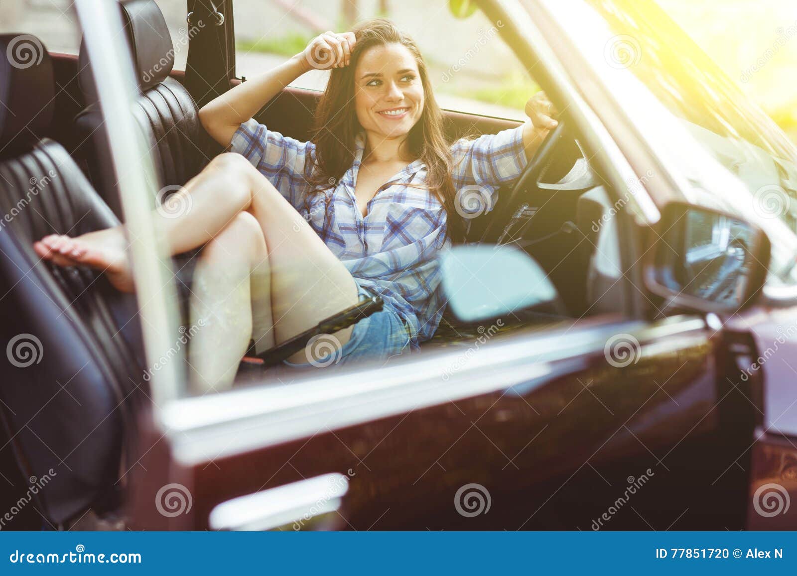 Beautiful Brunette in Short Shorts Sitting in Car, Tinted Photo Stock ...