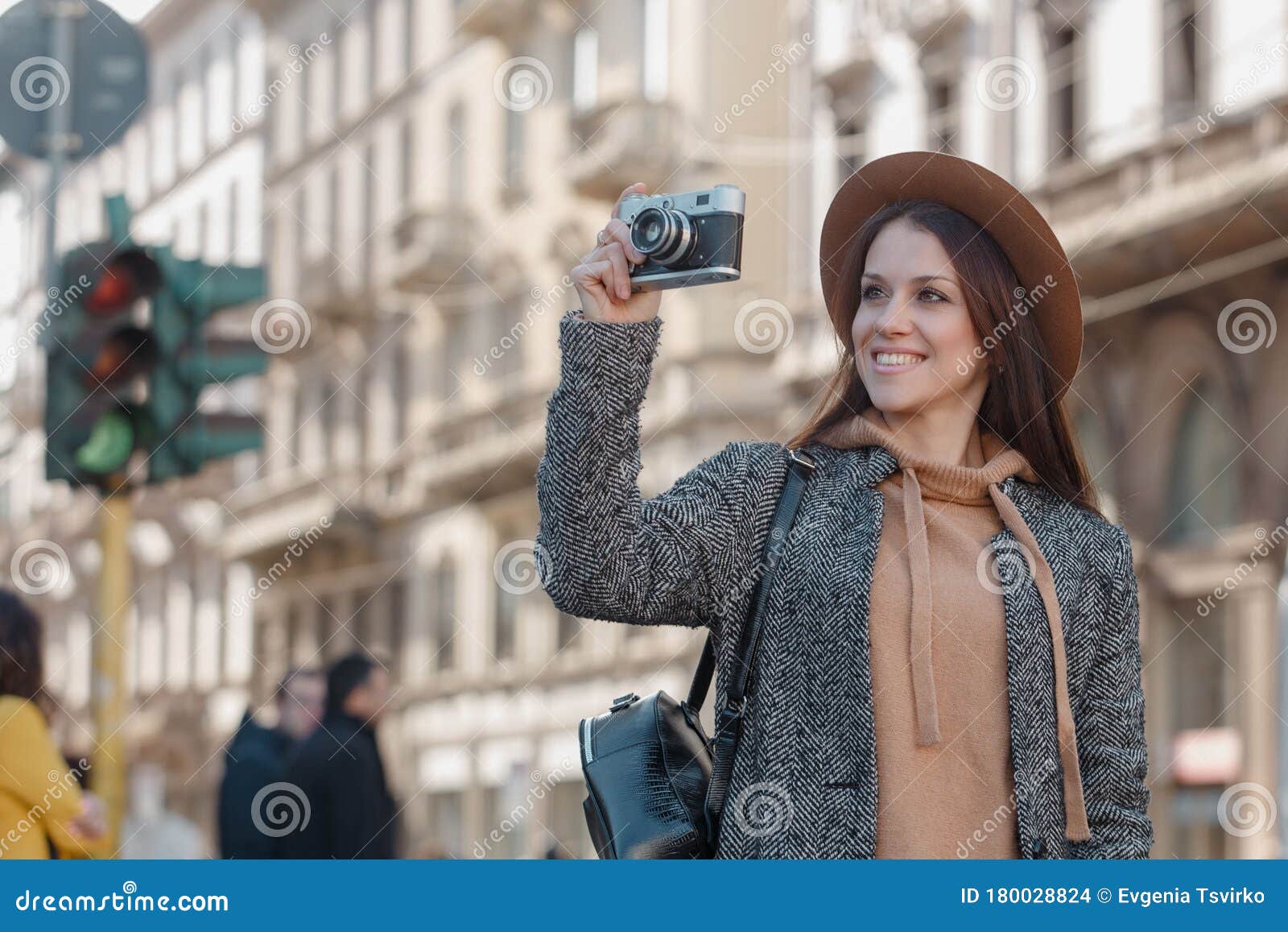 Beautiful Brunette Tourist Girl Holds a Camera in Her Hands and ...