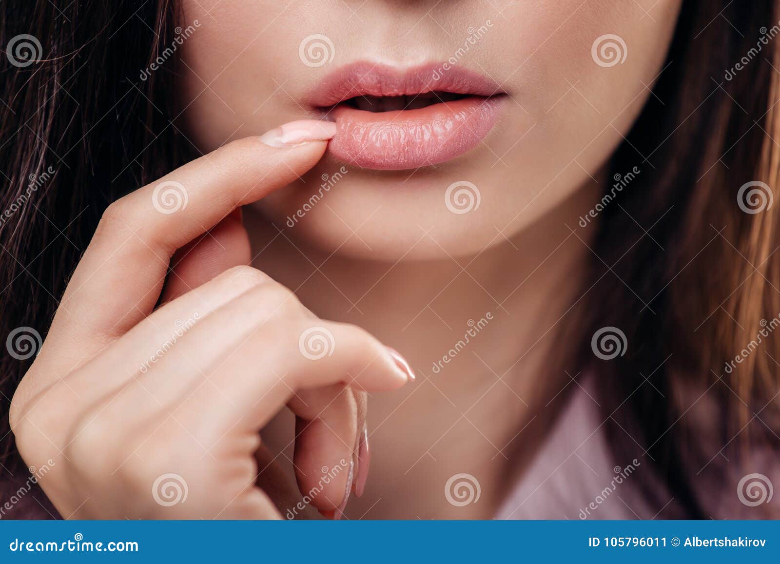 Beautiful Brunette Woman With A Finger At Her Mouth On White Background Stock Image Image Of