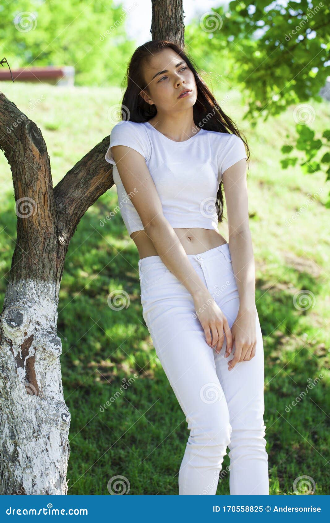 Beautiful Brunette Woman Posing Against Summer Park Bright Sunny 