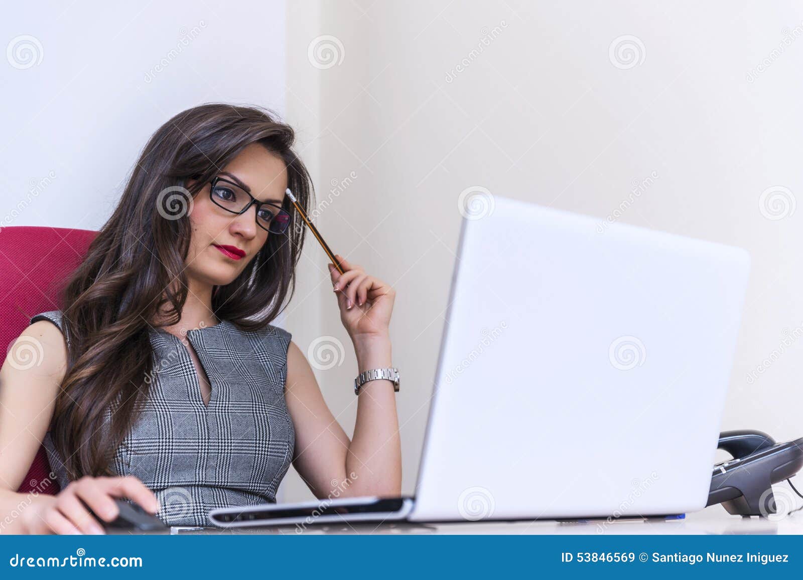 beautiful business woman working on computer at her office