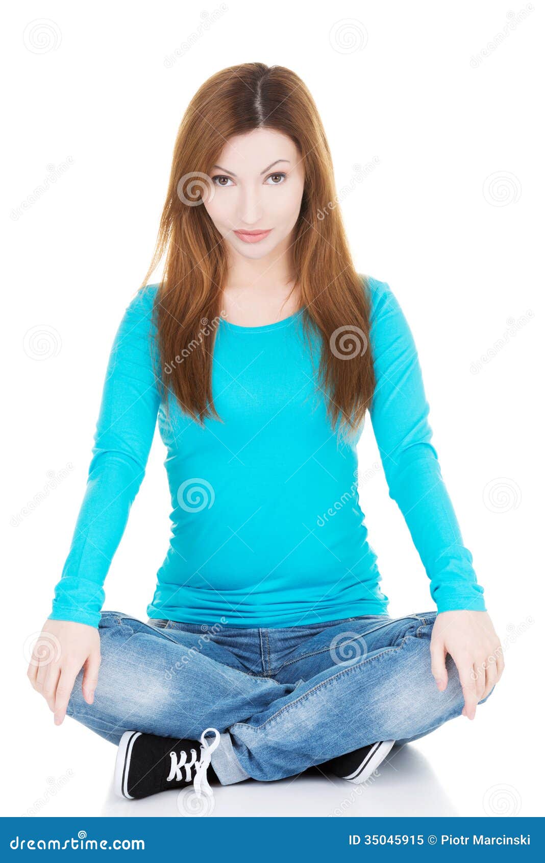 Beautiful Casual Woman Sitting And Holding Her Knees. Royalty Free