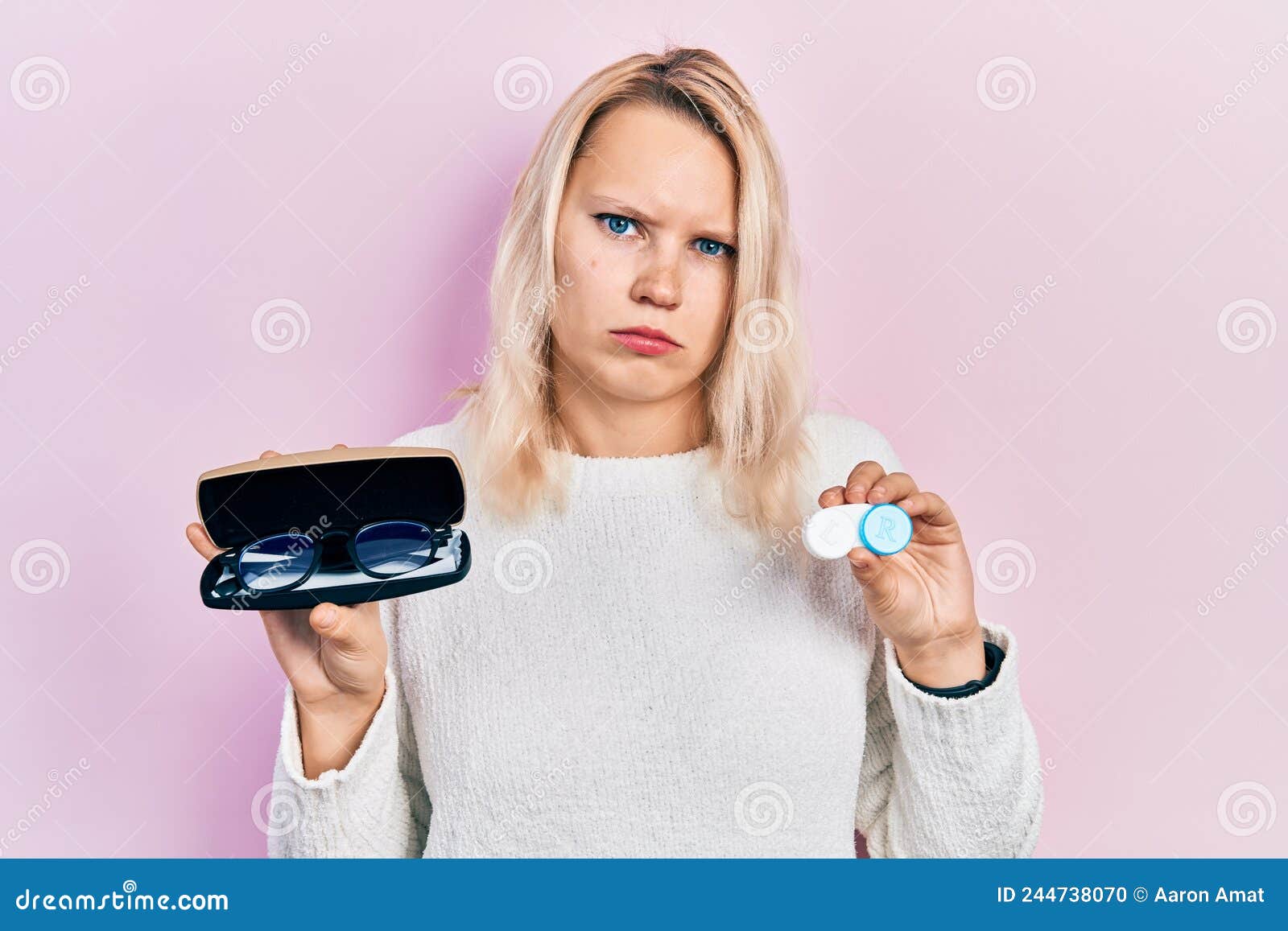 Beautiful Caucasian Blonde Woman Holding Glasses and Contact Lenses