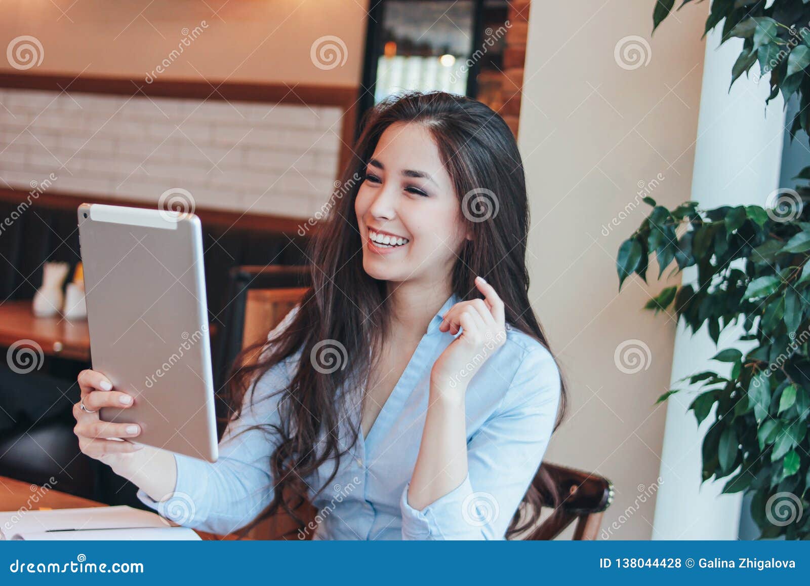 https://thumbs.dreamstime.com/z/beautiful-charming-brunette-smiling-asian-girl-speaking-studying-something-tablet-cafe-138044428.jpg