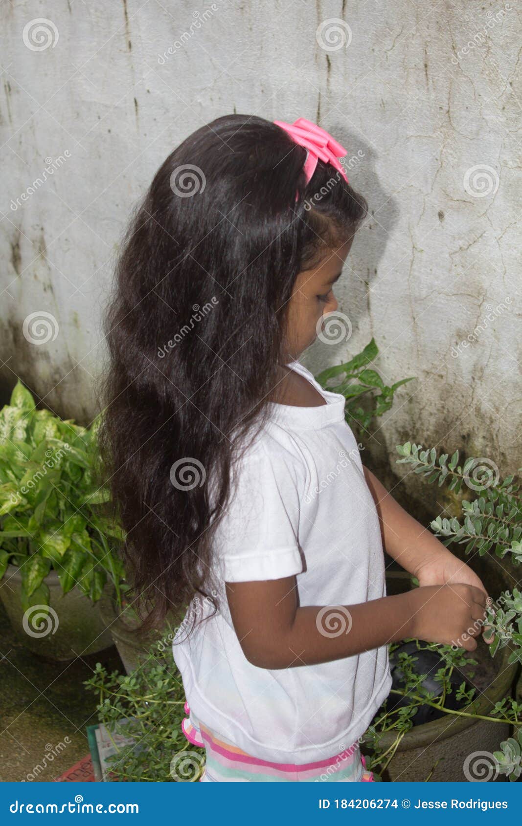Happy Funny African Girl Isolated On The Wall Stock Photo 184206274 -  Megapixl