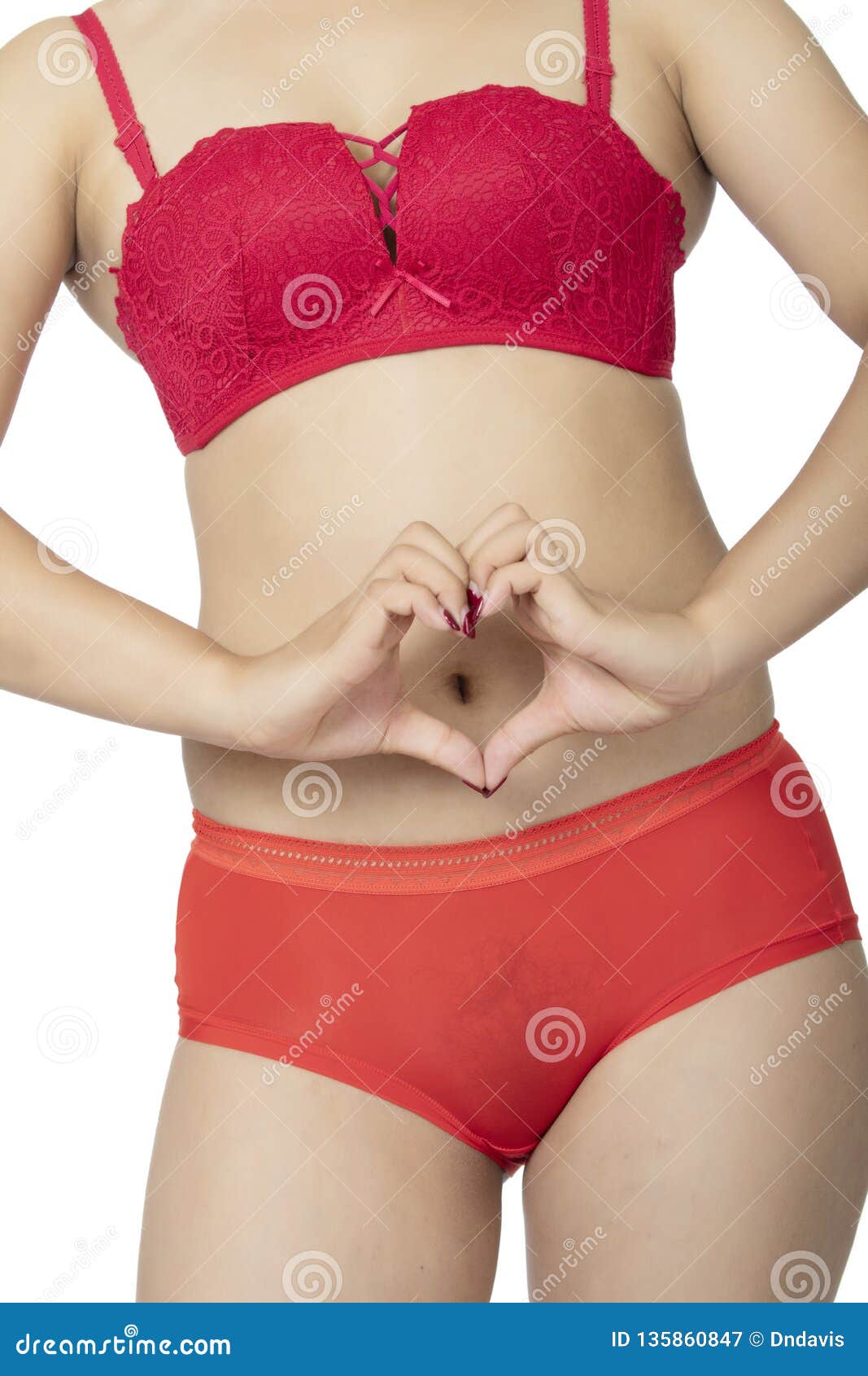 Chinese Woman Posing in Panties and Bra on White Background Stock