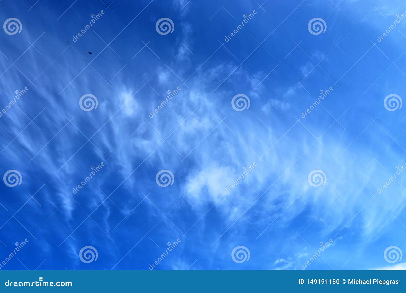 Beautiful Cirrus Cloud Formations in a Deep Blue Sky Stock Photo