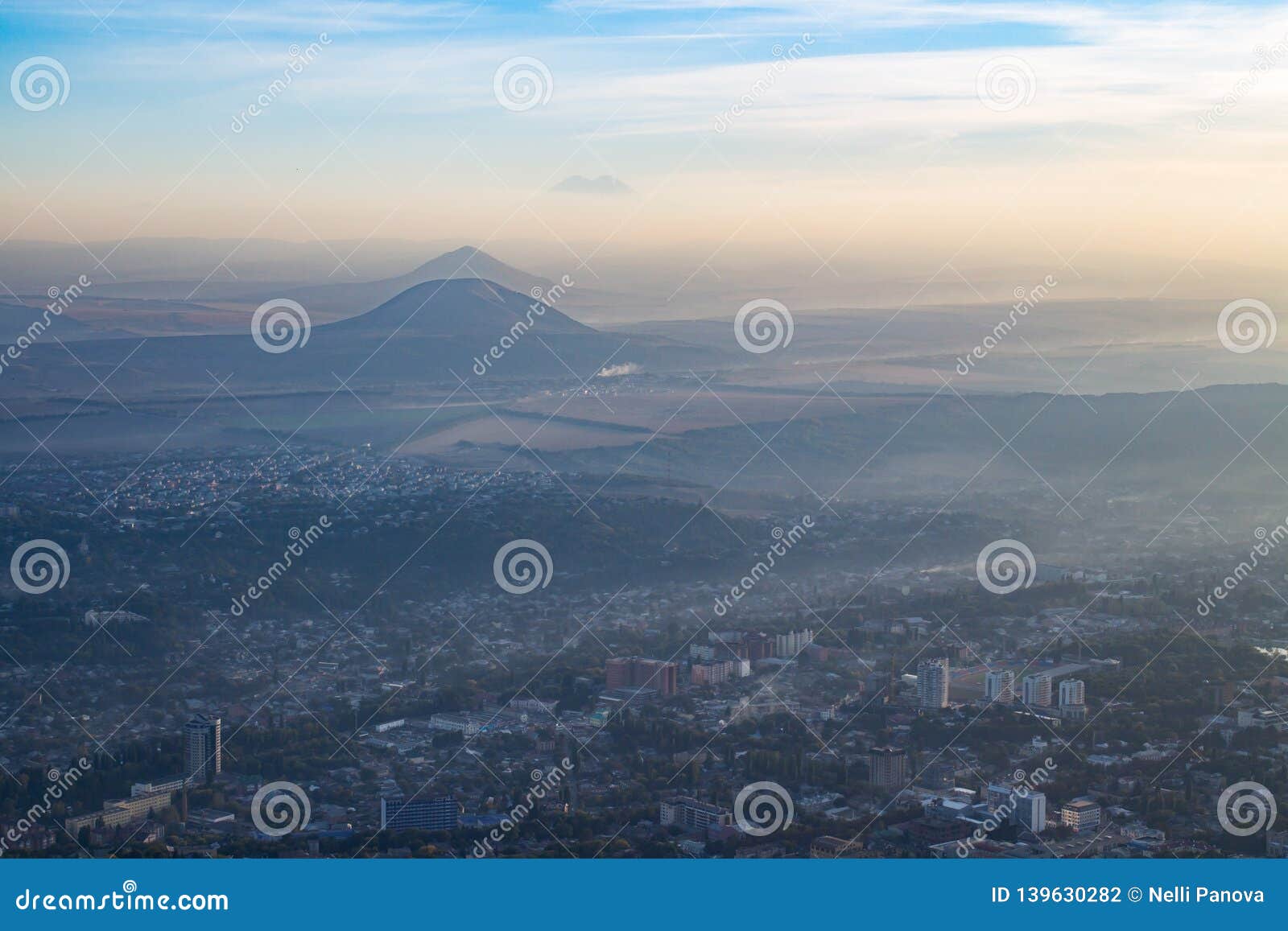 beautiful city with mountain in the haze