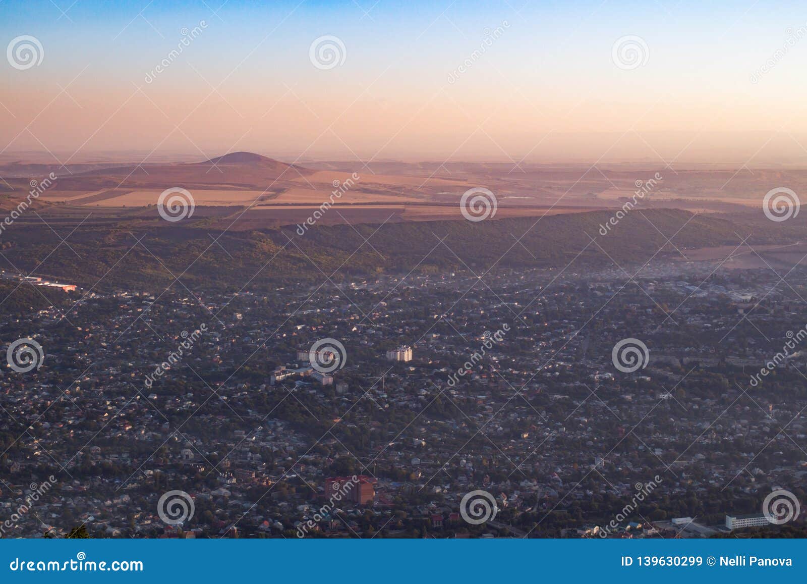 beautiful city with mountain in the haze