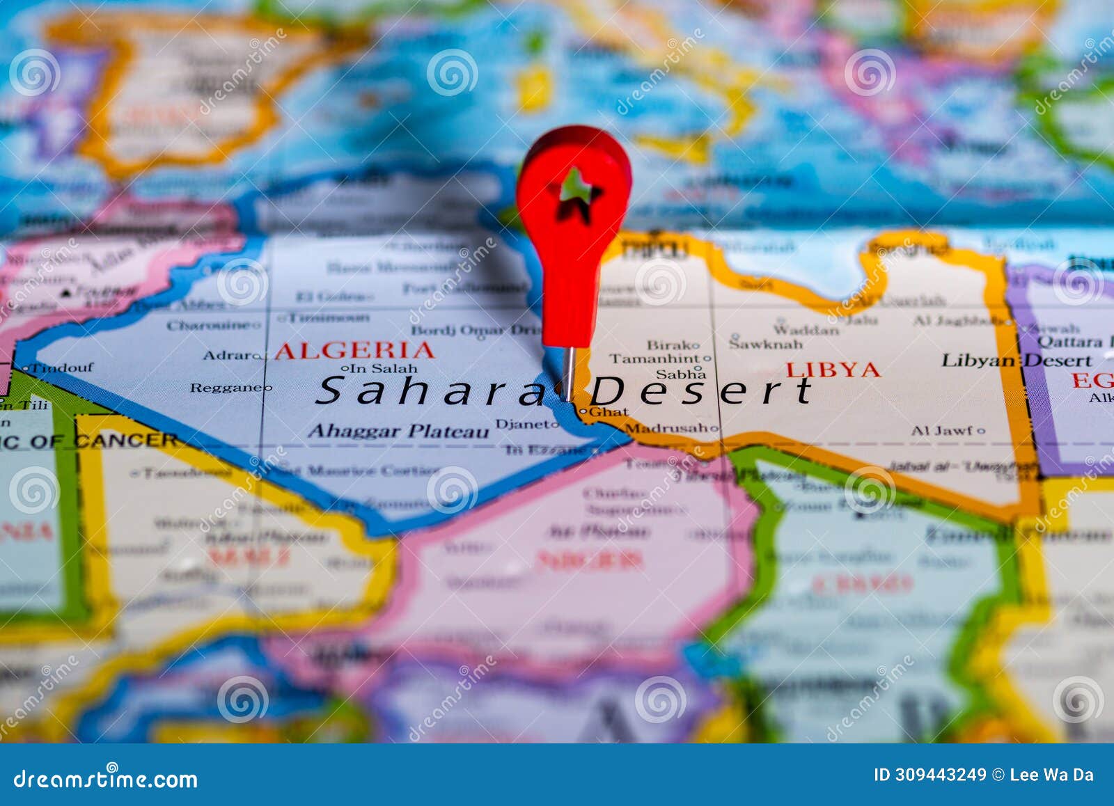 a beautiful macro shot at colourful and detailed map of the sahara desert
