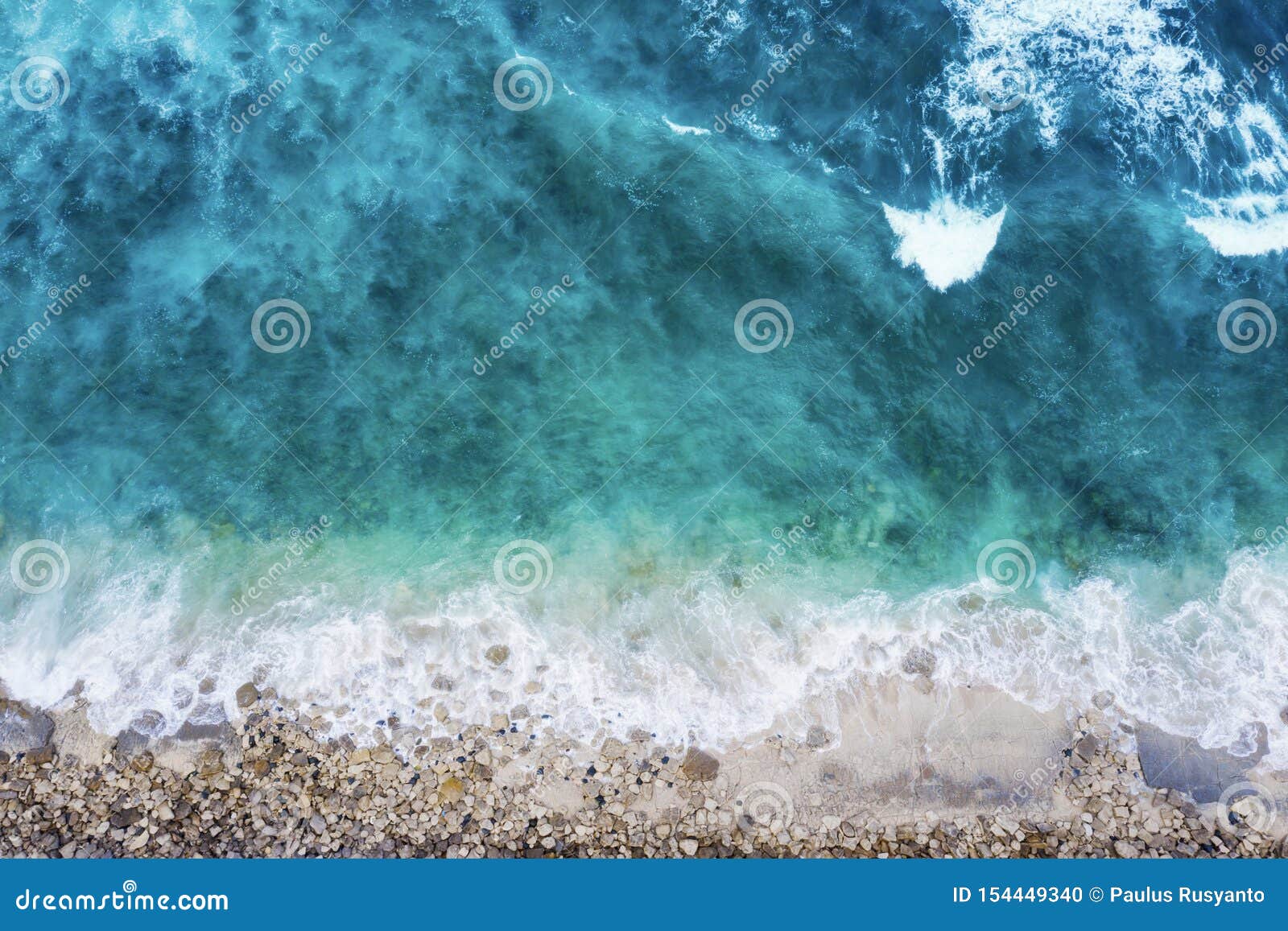 beautiful coastline with stones and frothy waves