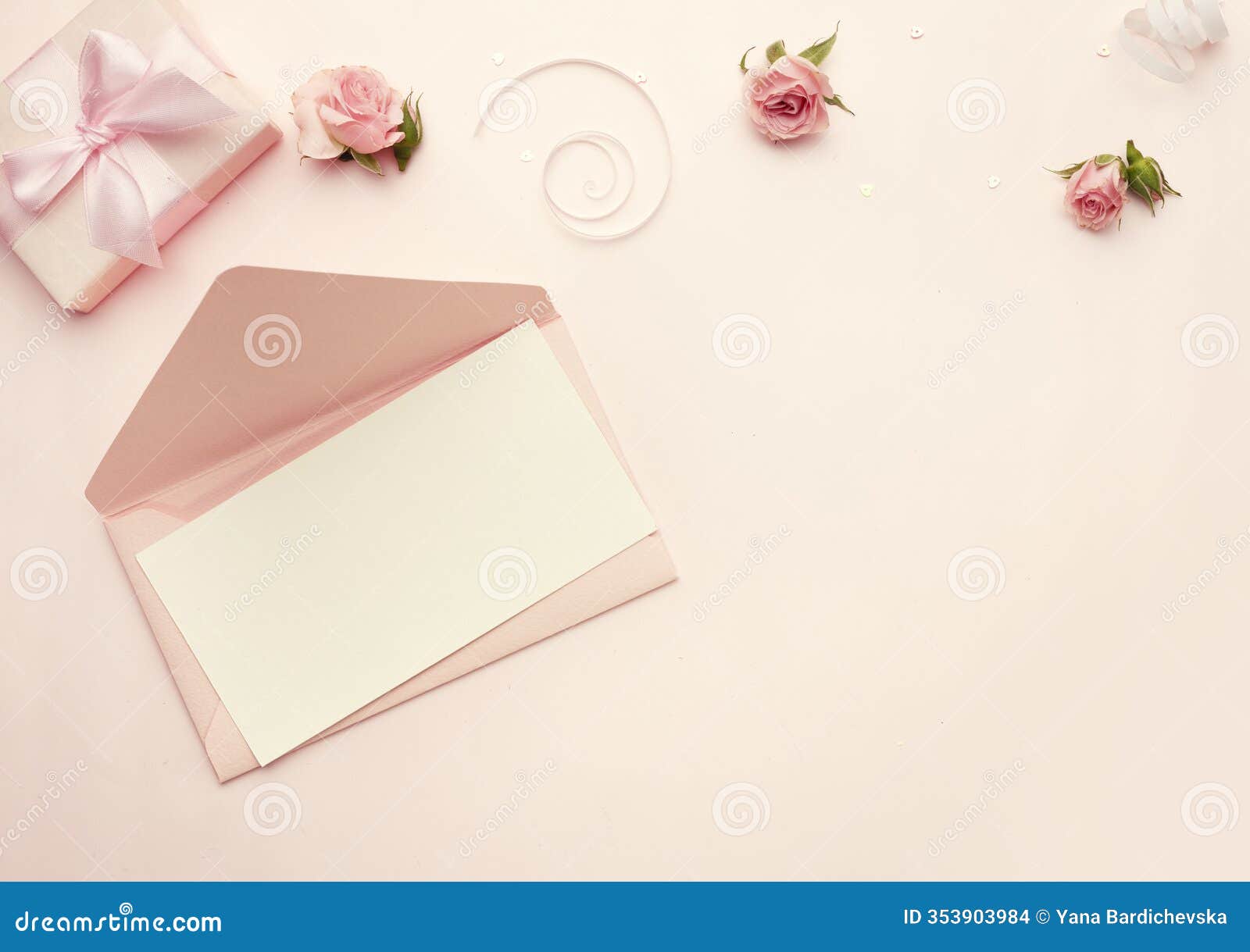 beautiful composition of enevelope and sheet blank empty space top view on pink background decorated with flowers.mother's
