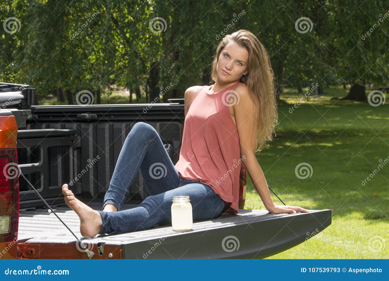 Beautiful Country Girl On Back Of Pickup Truck Stock Image