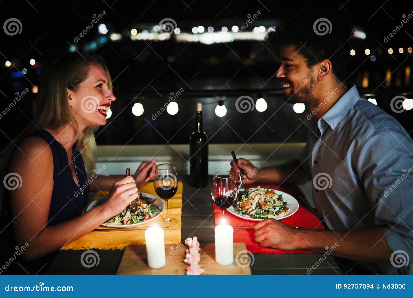 Beautiful Couple in Love Having Romantic Dinner at Night Stock Photo