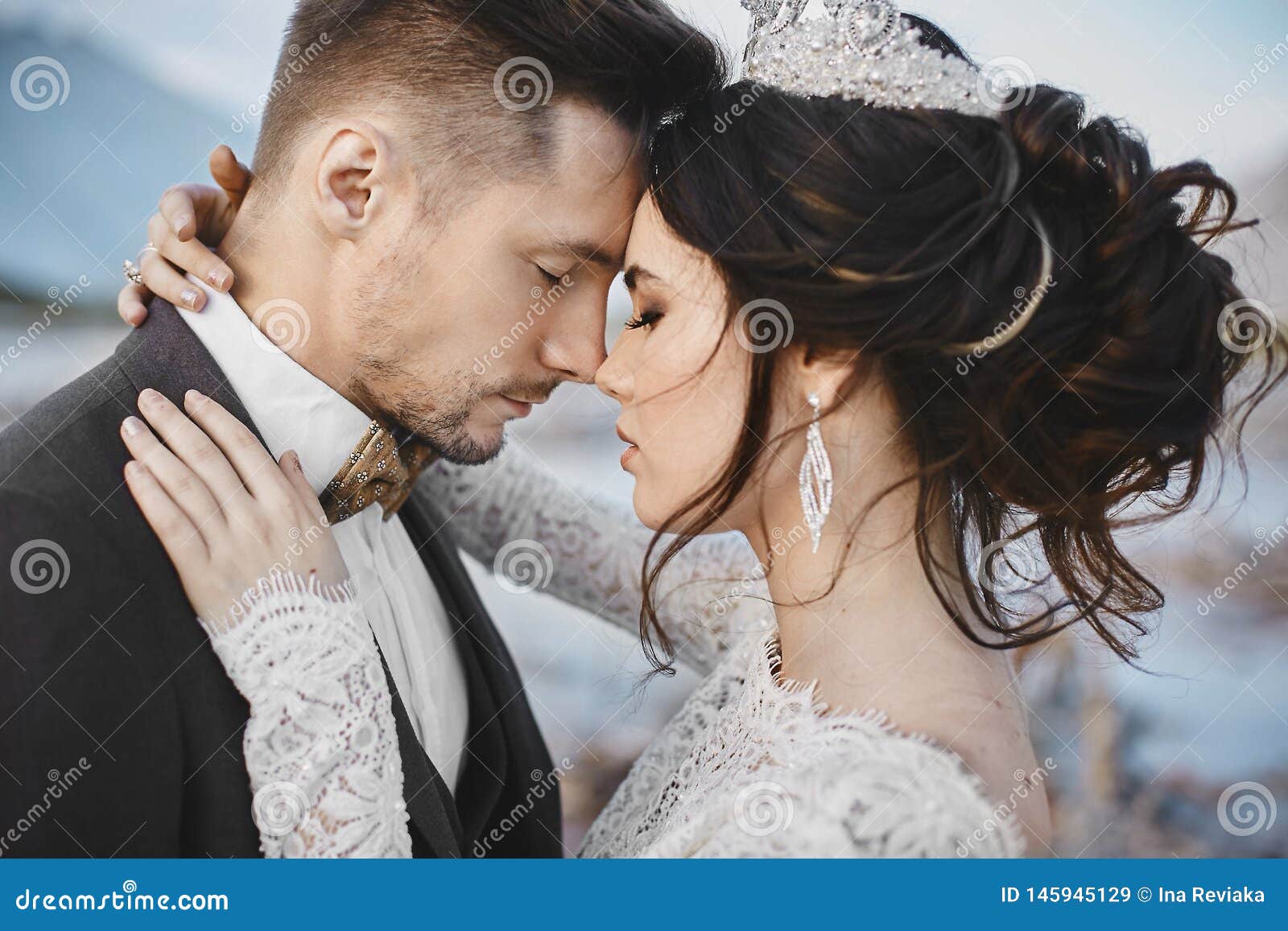 Beautiful Couple of Lovers Hugging, a Young Woman with Wedding Hairstyle and Luxury Jewelry and Handsome Brutal Man in Stock Image - Image of outdoors, girl: 145945129 Beautiful Couple of Lovers Hugging, a Young Woman with Wedding Hairstyle and Luxury Jewelry and Handsome Brutal Man in Stock Image - Image of outdoors, girl: 145945129