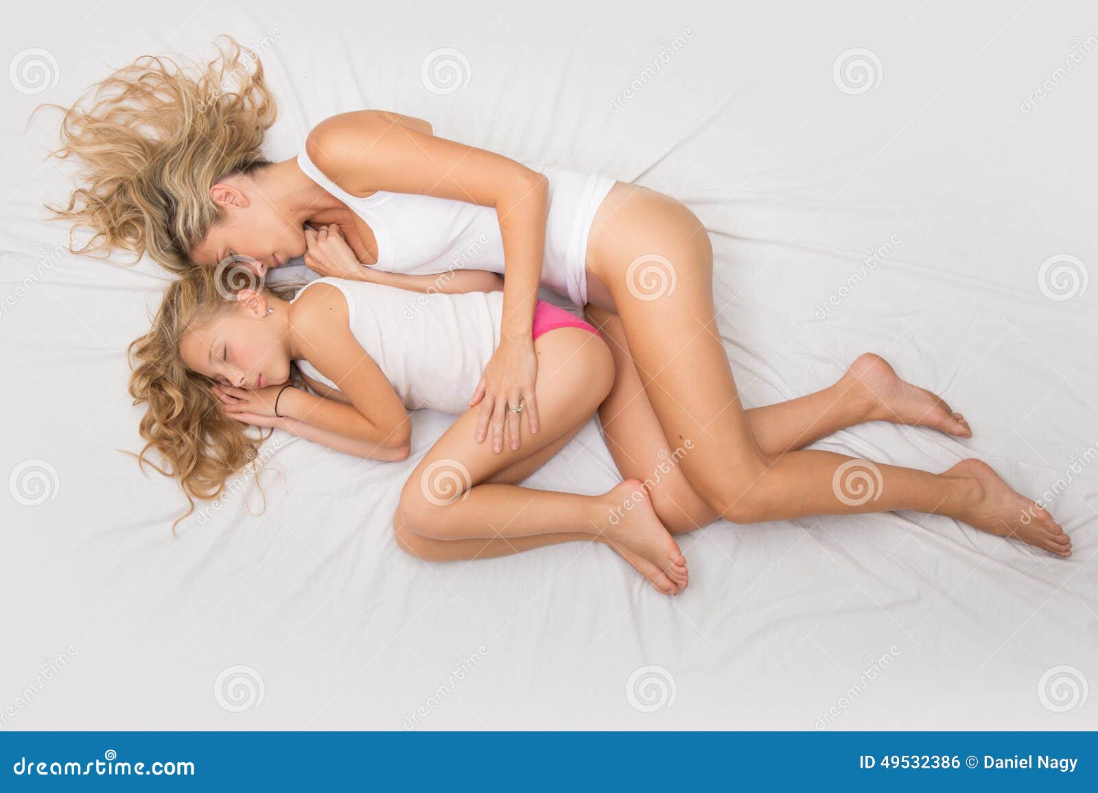 Beautiful Curly Blonde Woman and Child Sleep Together Stock Photo