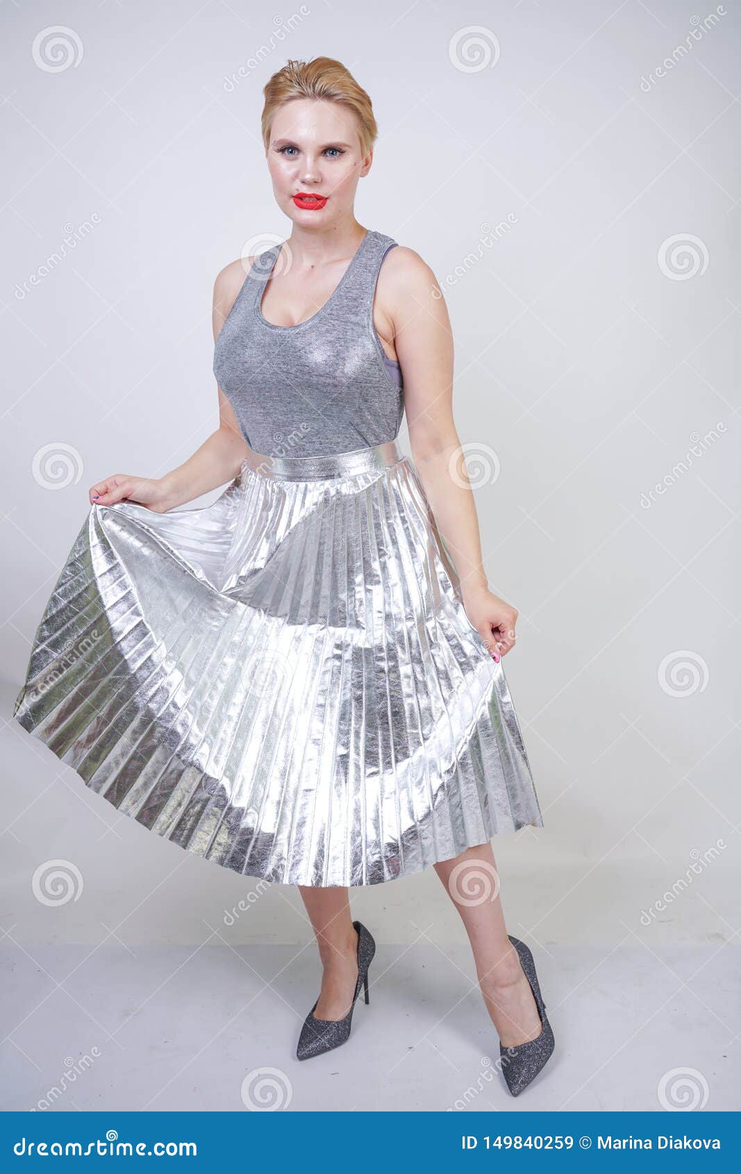 Beautiful Curvy Girl Short Hair in Silver Tank Top and Metallic Pleated Skirt on White Background in Studio. Blonde Pl Stock Image - Image of artistic, isolated: 149840259