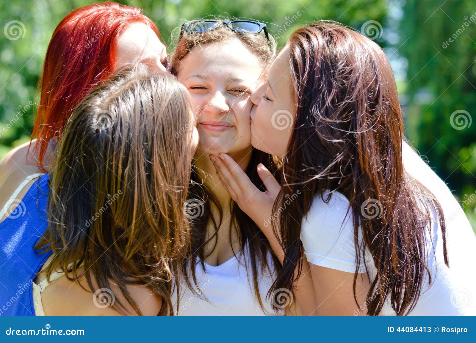 4 Beautiful Cute Girls Friends Having Fun Kissing Each Other Happy