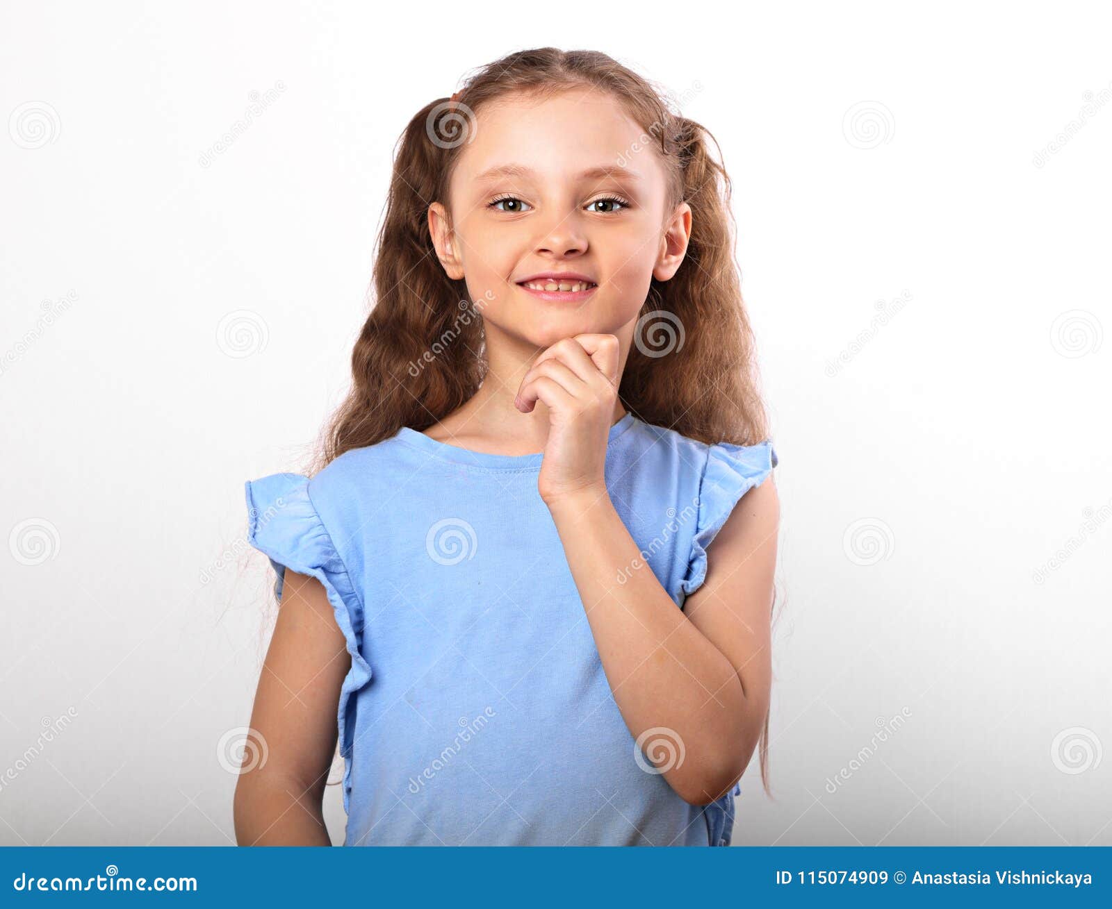 little girl with closed hands at face little girl with closed hands at face