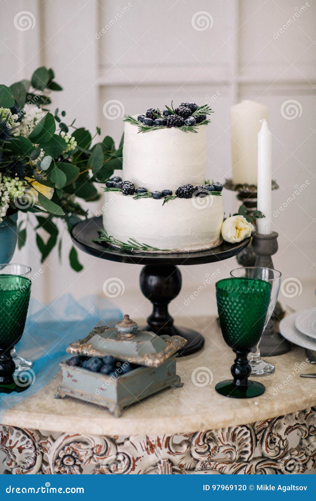 Beautiful Decorate Table with Candles and Wedding Cake on the Table in