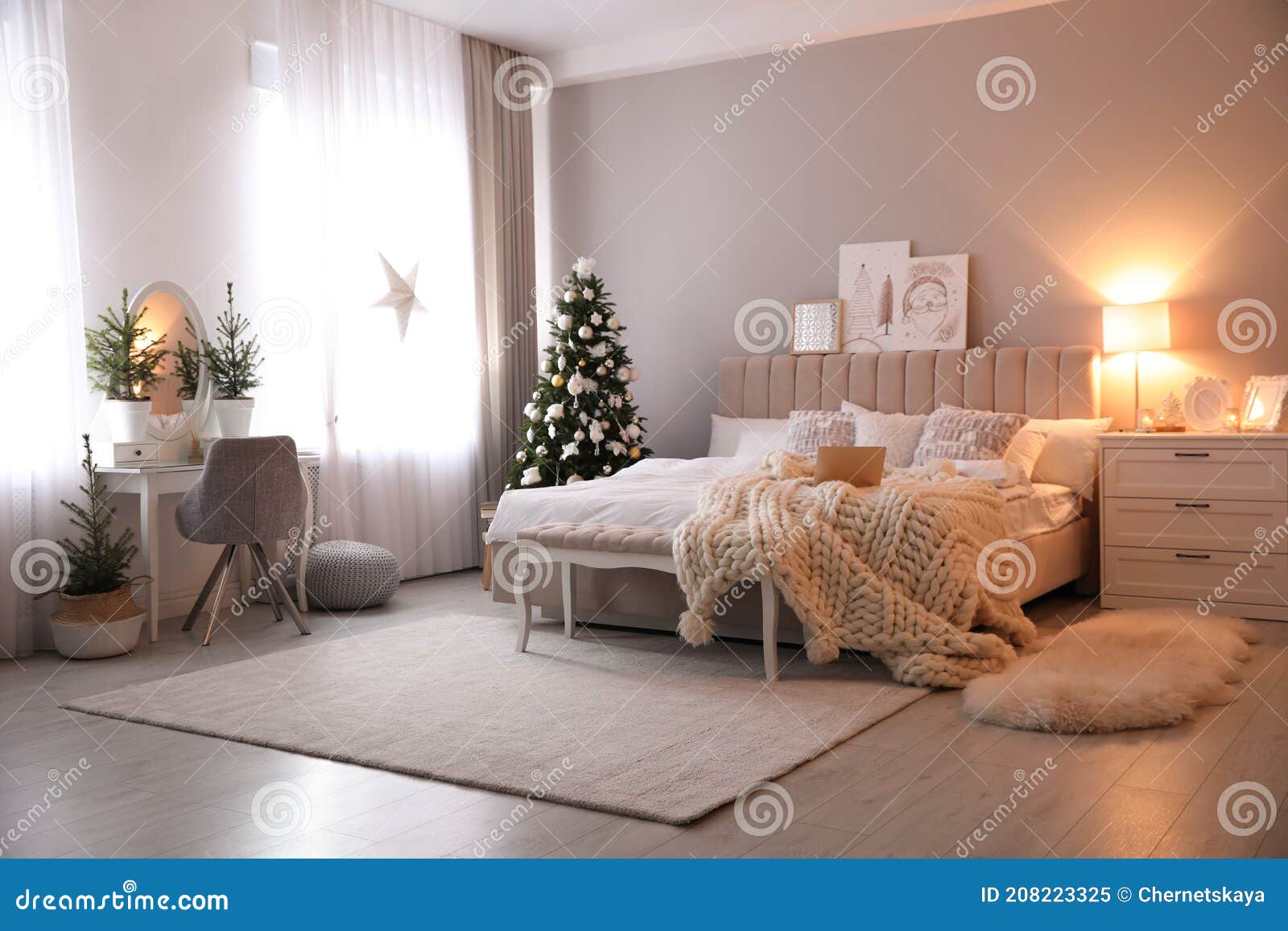 Beautiful Decorated Christmas Tree in Bedroom Interior Stock Image