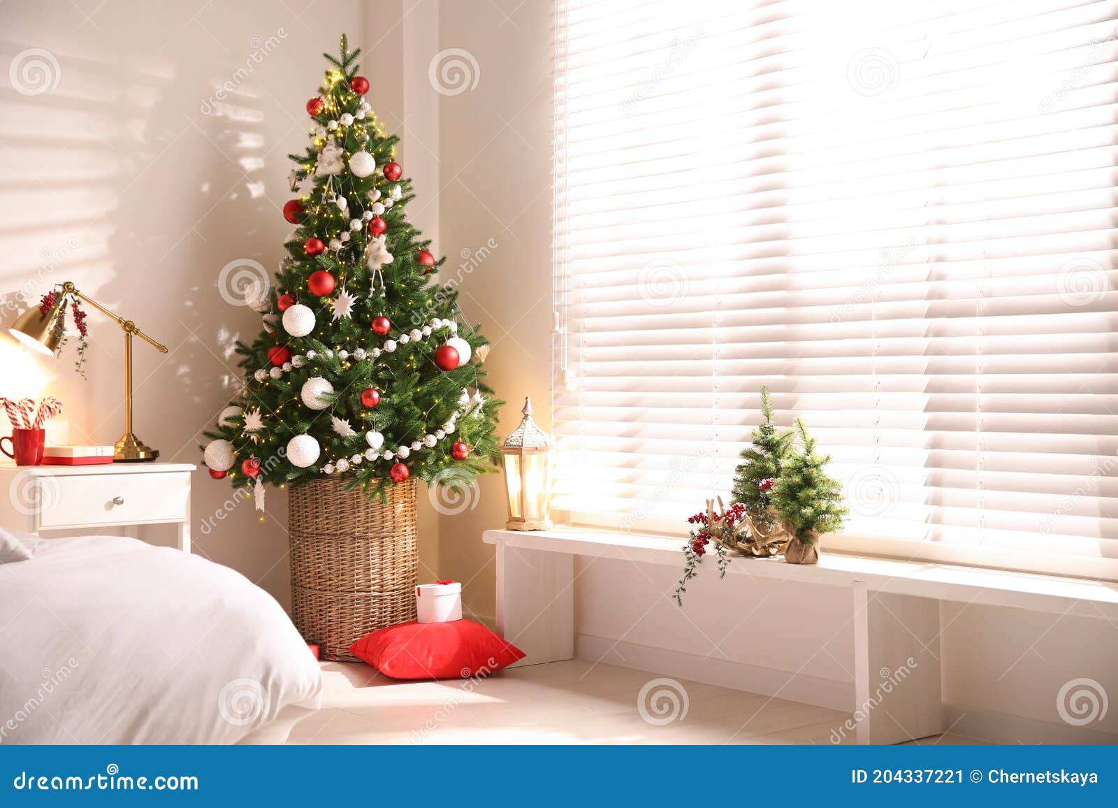 Beautiful Decorated Christmas Tree in Bedroom Interior, Space for Text