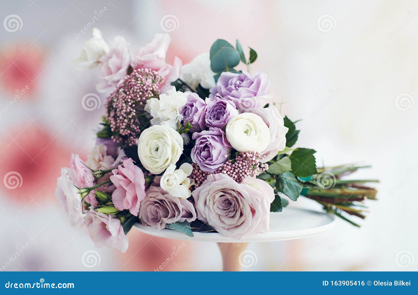 Beautiful Delicate Flower Bouquet with Roses, Ranunculuses, Eustomas and Carnations Stock Photo